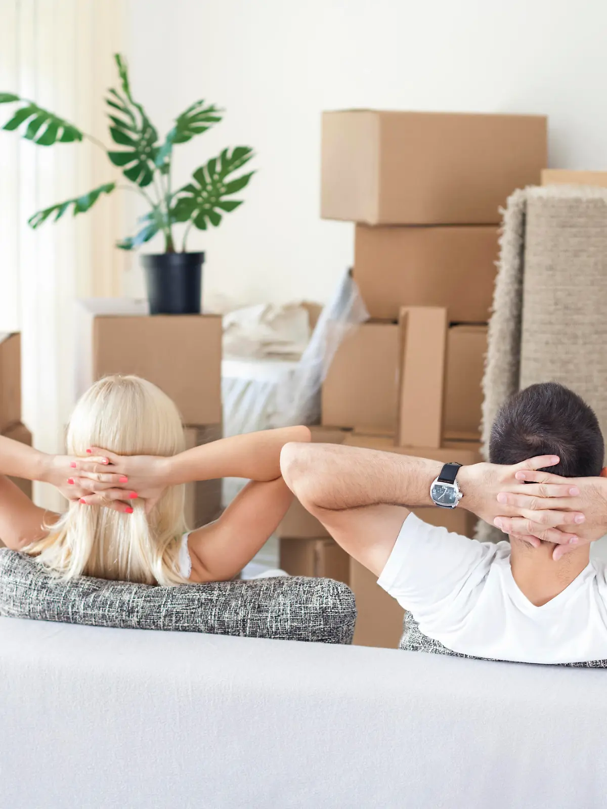 Couple resting in new home, break after hard work