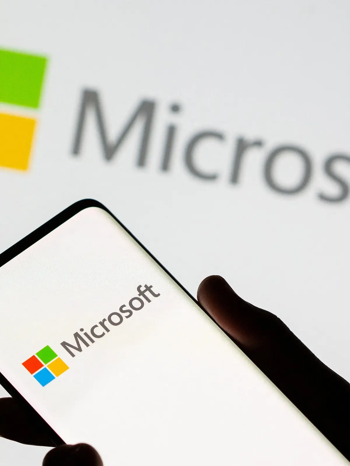 FILE PHOTO: Smartphone is seen in front of Microsoft logo displayed in this illustration taken, July 26, 2021. REUTERS/Dado Ruvic/Illustration/File Photo
