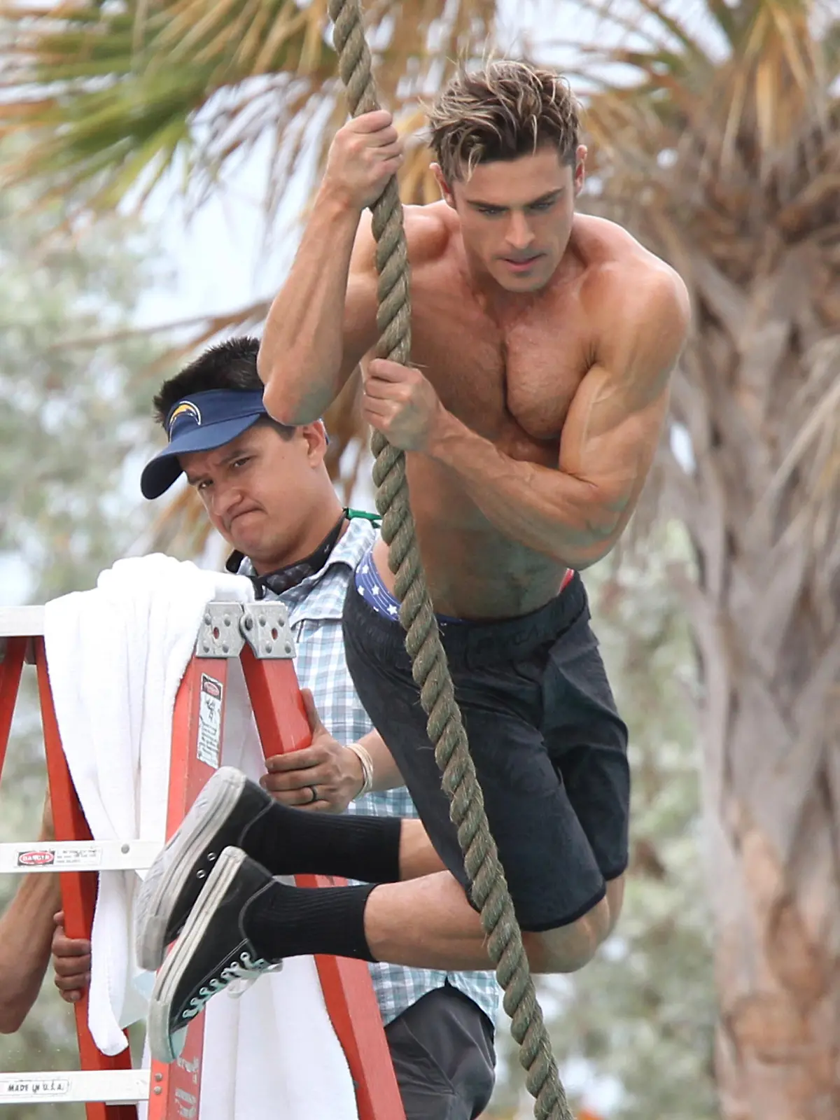 Zac Efron shirtless  filming scenes for Baywatch in Miami Beach.