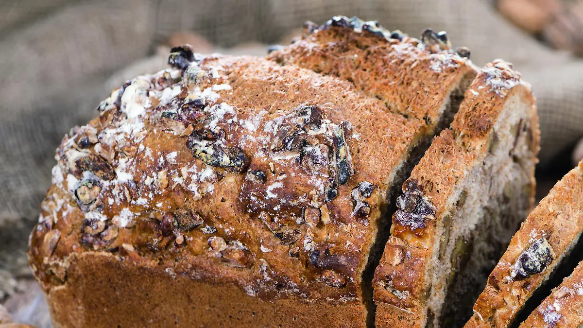 Fresh made Walnut Bread (detailed close-up shot) on wooden background