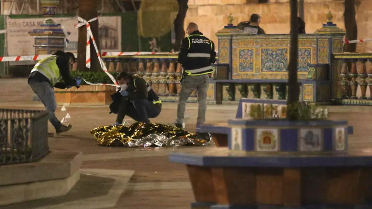 Police work next to the body of a man killed in Algeciras, southern Spain, Wednesday, Jan. 25, 2023. Spain's interior ministry says that one person has been killed and another serious injured in an attack carried out by a person with a bladed weapon at a church in the southern city of Algeciras on Wednesday. The attacker has been arrested and is in custody of Spain's National Police. (Nono Rico/Europa Press via AP)