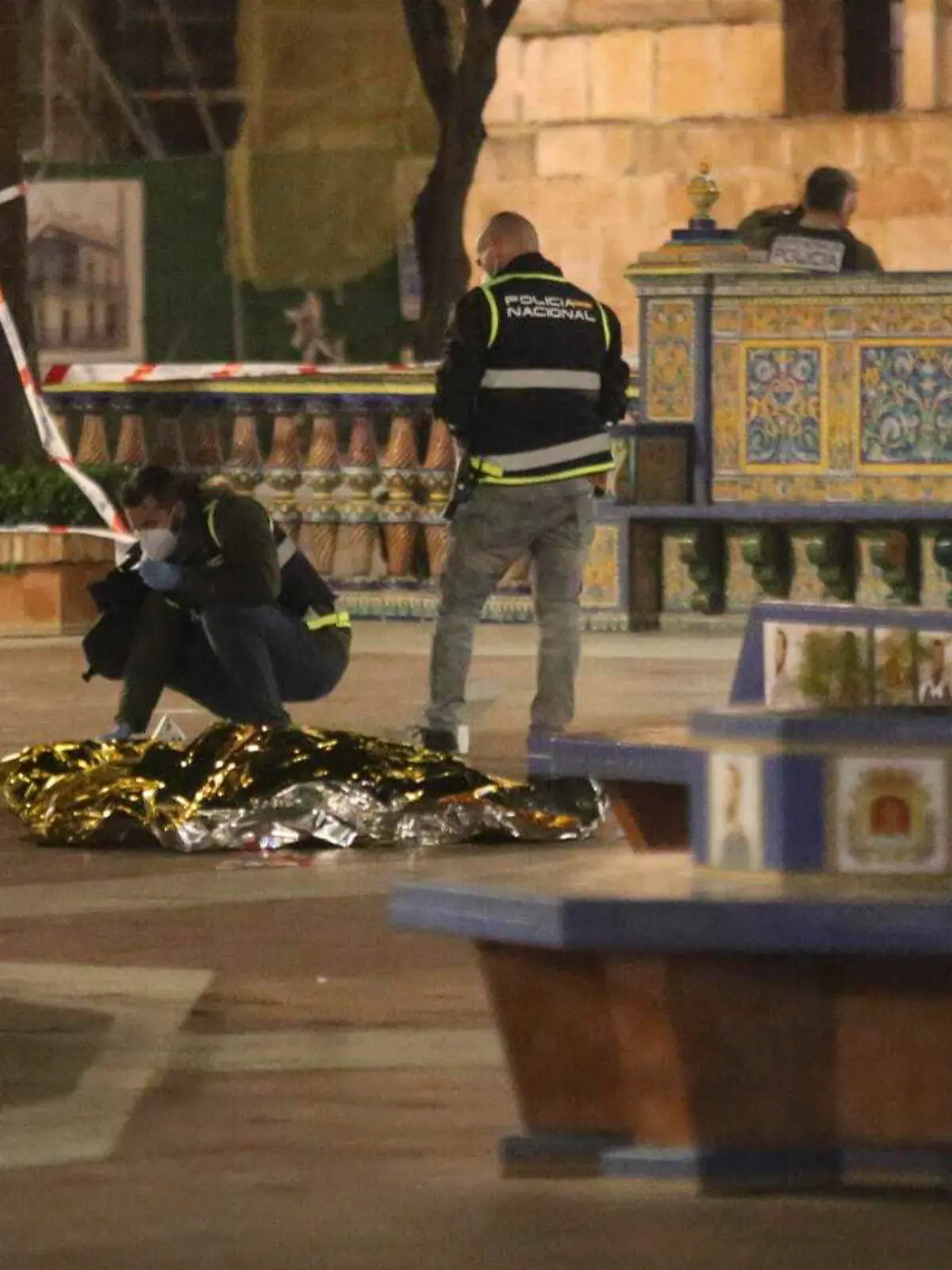 Police work next to the body of a man killed in Algeciras, southern Spain, Wednesday, Jan. 25, 2023. Spain's interior ministry says that one person has been killed and another serious injured in an attack carried out by a person with a bladed weapon at a church in the southern city of Algeciras on Wednesday. The attacker has been arrested and is in custody of Spain's National Police. (Nono Rico/Europa Press via AP)