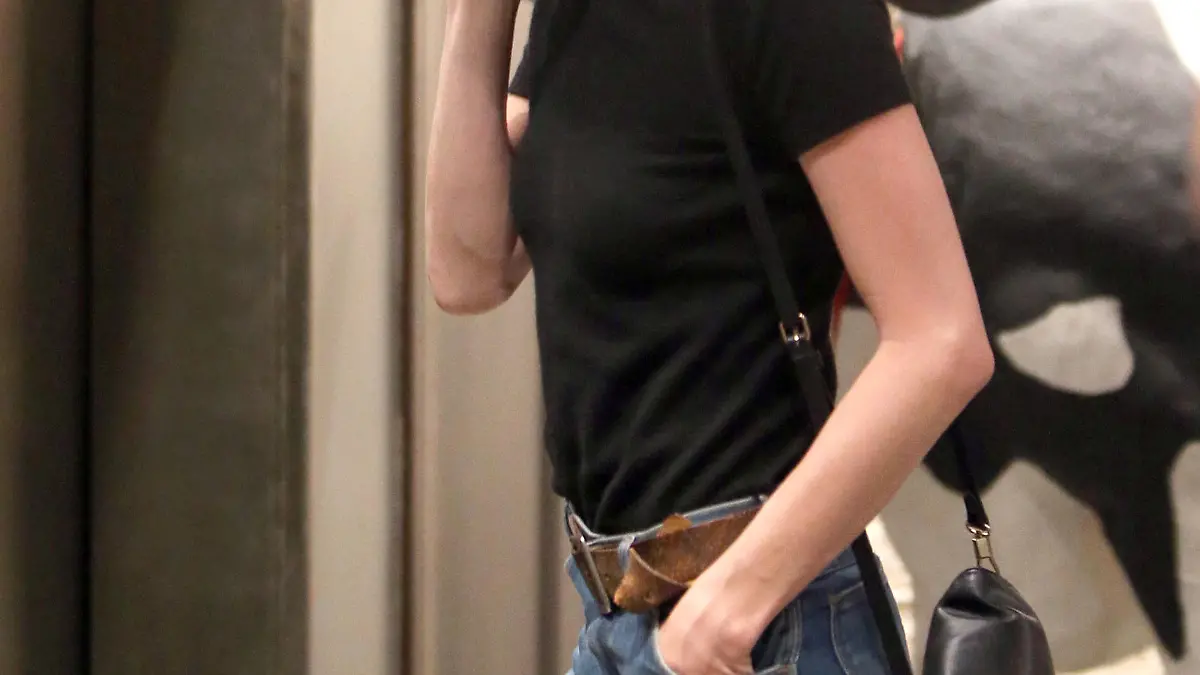 Amber Heard arrives at an office building in Los Angeles, California. Johnny Depp's estranged wife covered up with a hat and sunglasses as she entered the building, talking on her phone.