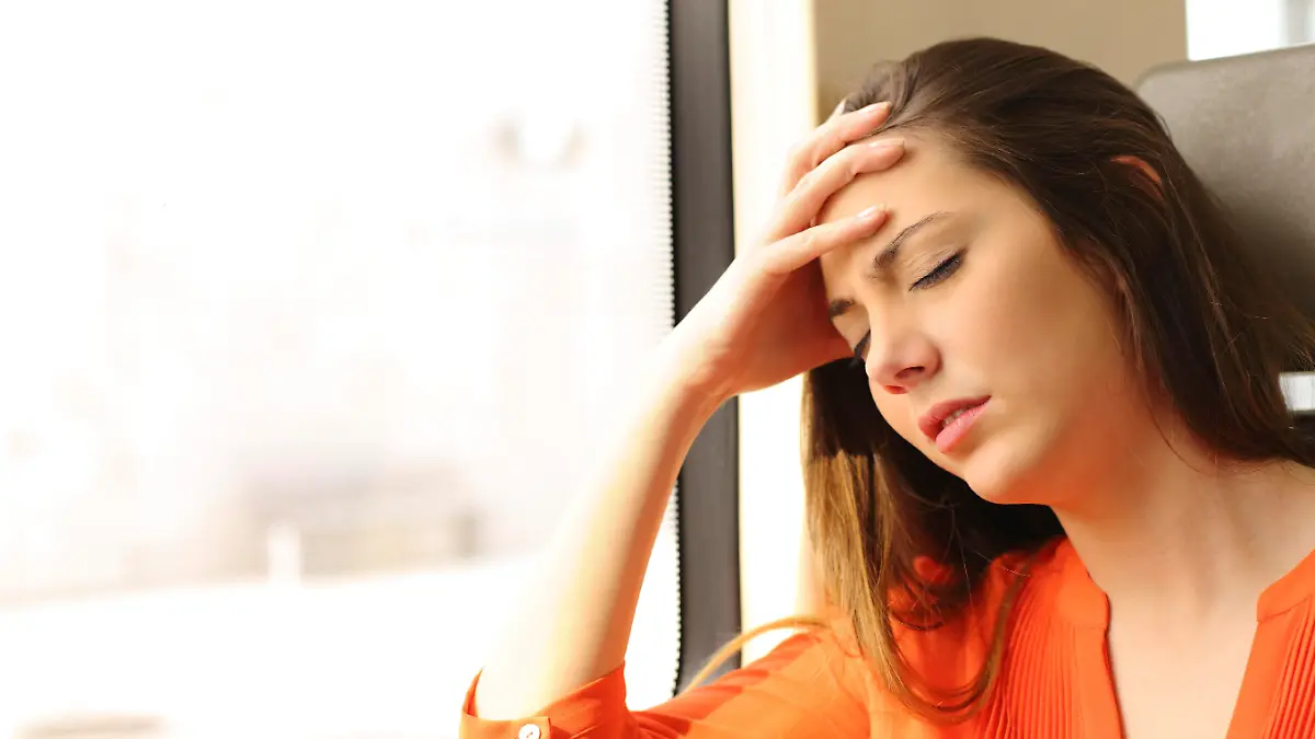 Passenger traveling and feeling dizzy with headache in a train travel