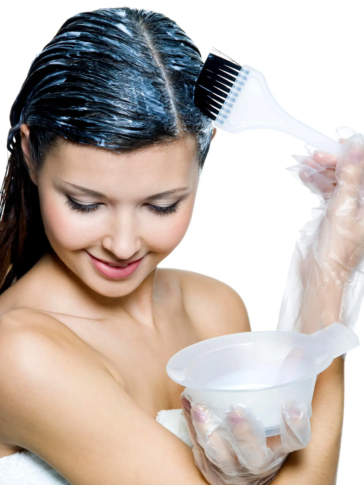 Portrait of beautiful young woman dyeing hairs - isolated on white