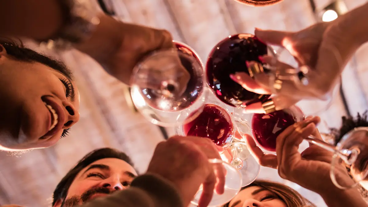 Low angle view of happy start up team toasting to their success.