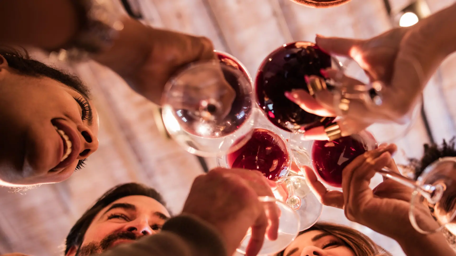 Low angle view of happy start up team toasting to their success.