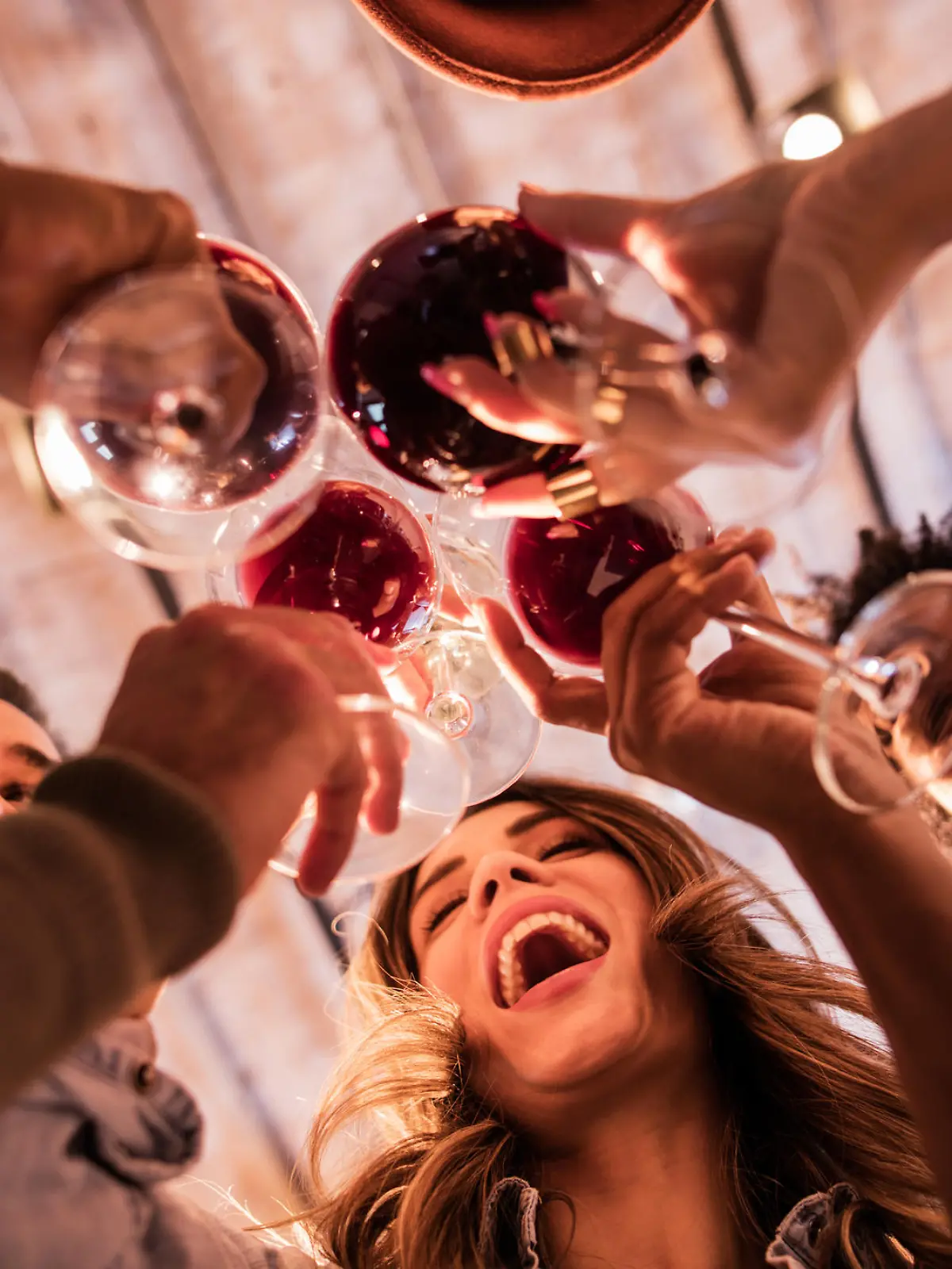 Low angle view of happy start up team toasting to their success.