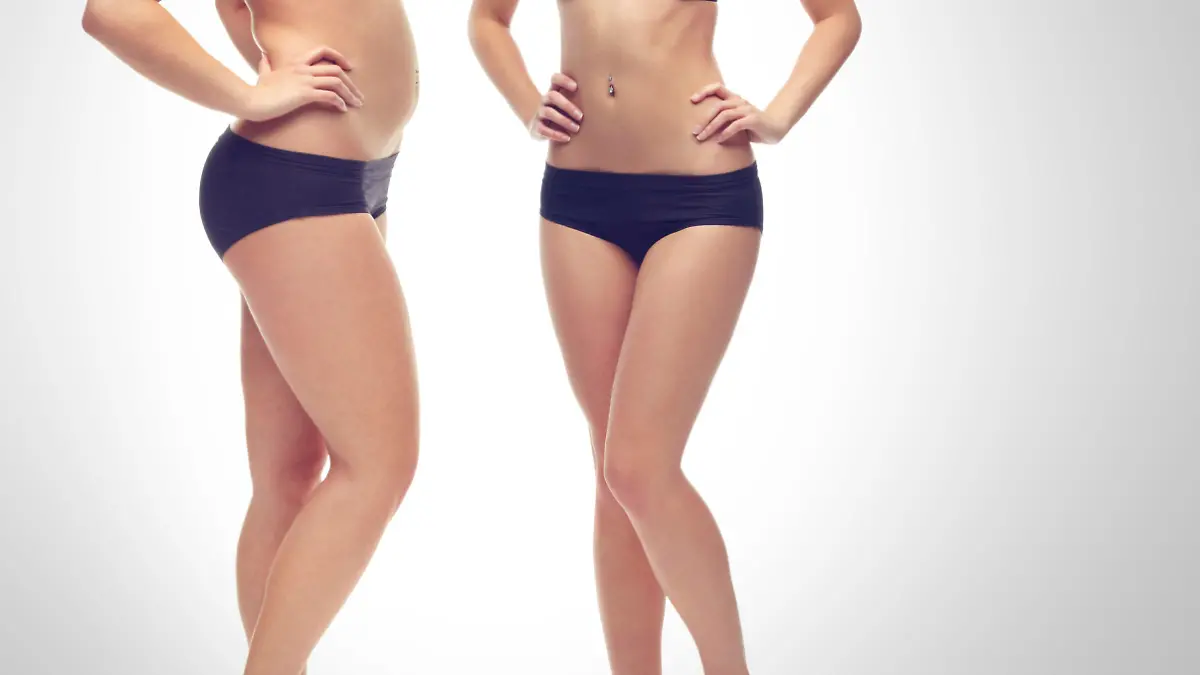 A slim young woman in her underwear isolated on a white background