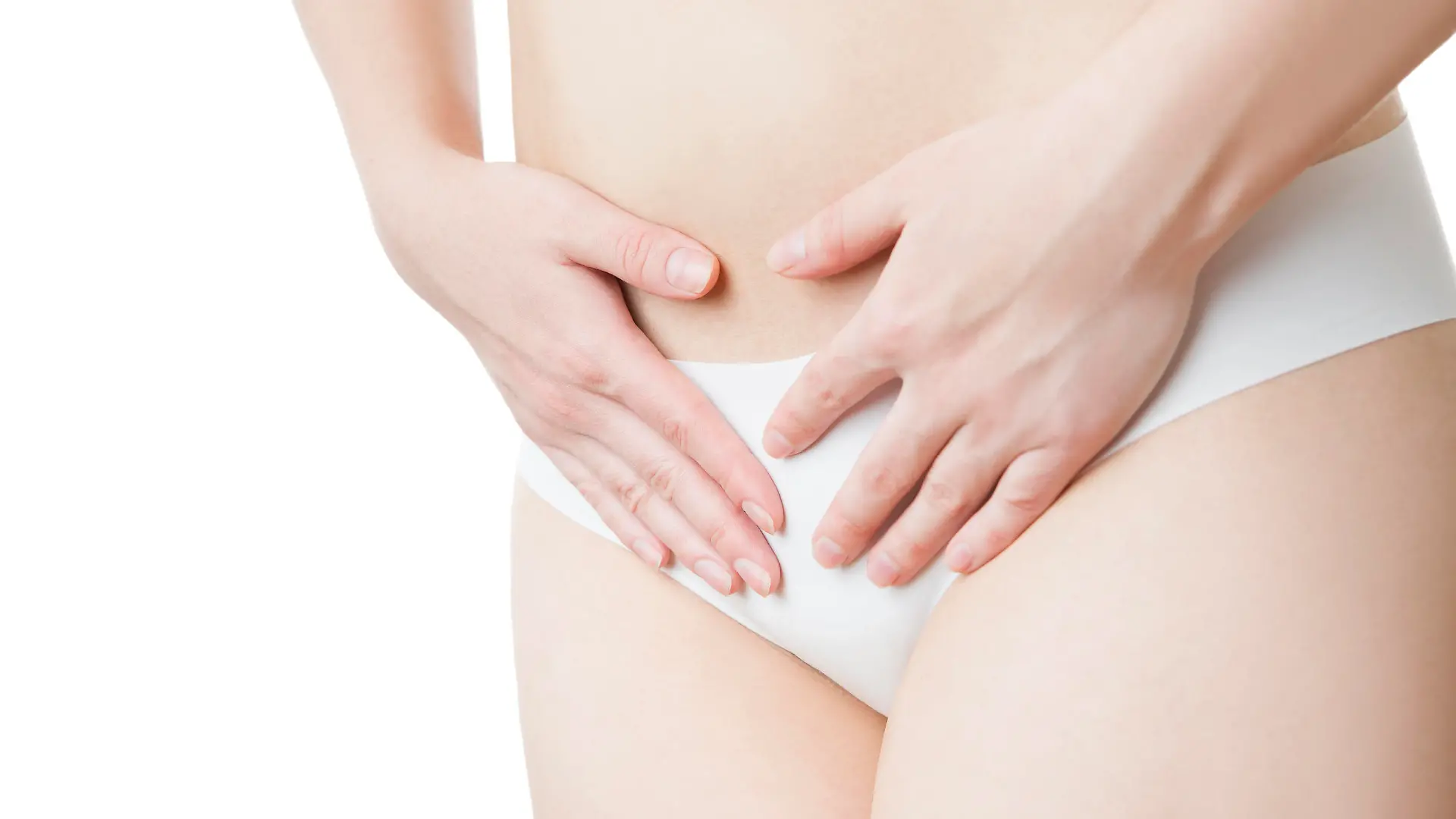 Pain in the abdomen. A girl in black panties. Isolated on white background.