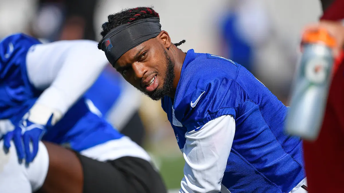 File - Buffalo Bills safety Damar Hamlin warms up during practice at the NFL football team's training camp in Pittsford, N.Y., July 30, 2023. Hamlin is preparing for the next step to resume his career by suiting up in Buffalo's preseason-opening game against the Indianapolis Colts on Saturday, Aug. 12, 2023. (AP Photo/Adrian Kraus, File)