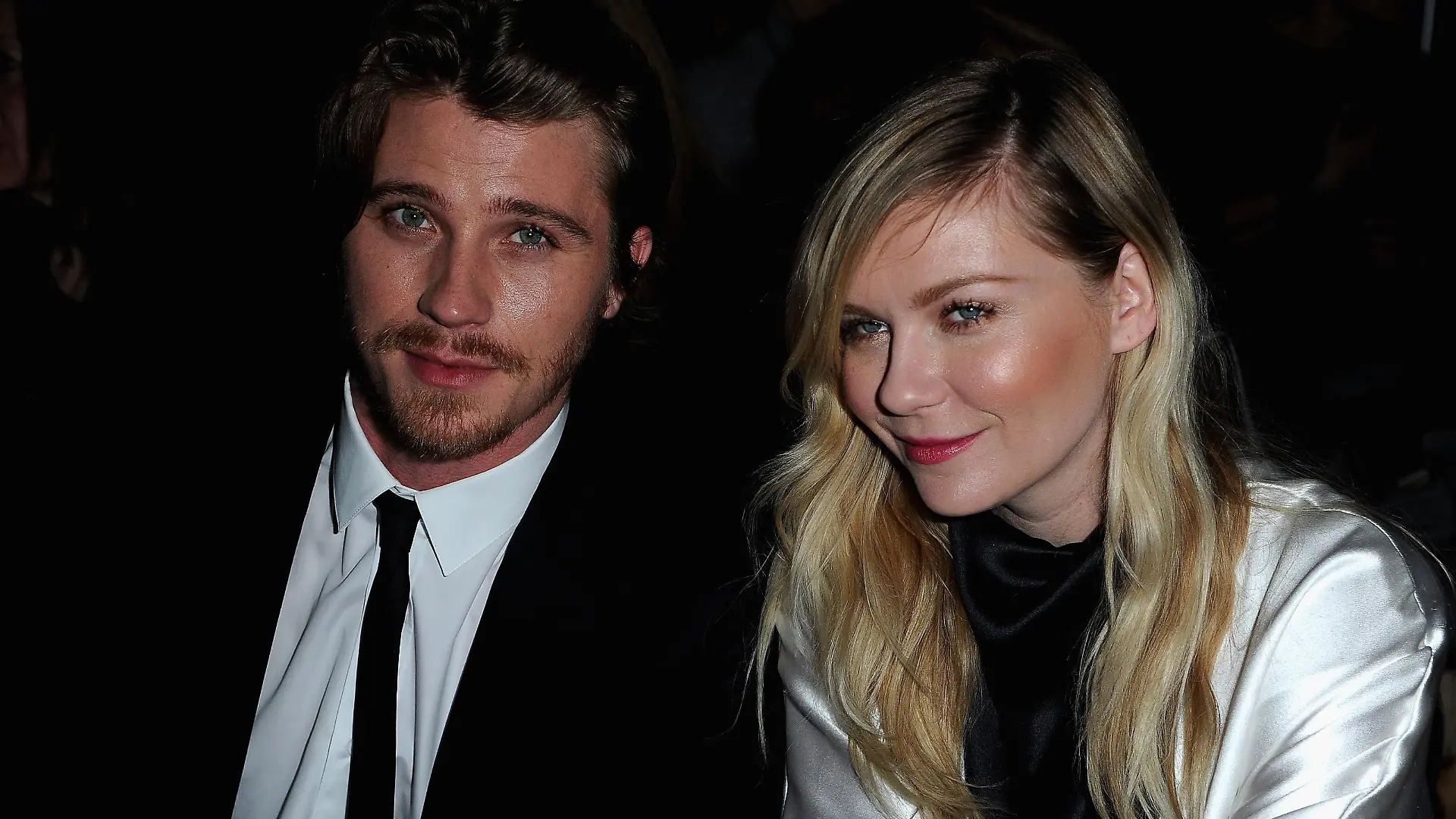 PARIS, FRANCE - MARCH 04: Kirsten Dunst and Garrett Hedlund attend the Saint Laurent Fall/Winter 2013 Ready-to-Wear show as part of Paris Fashion Week on March 4, 2013 in Paris, France. (Photo by Pascal Le Segretain/Getty Images)