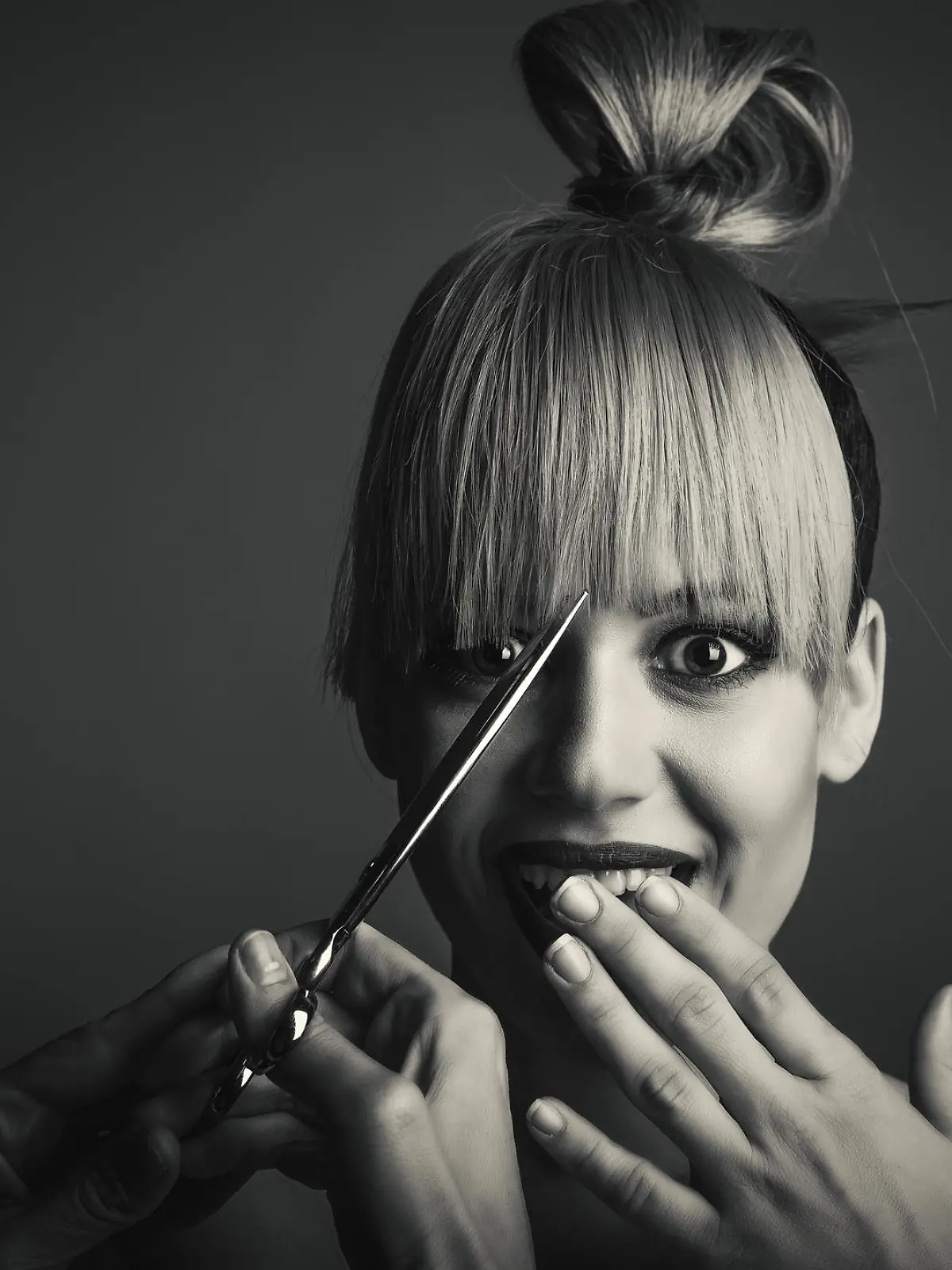 Studio shoot of hairdressing cut.Urban woman with hair up have a haircut.