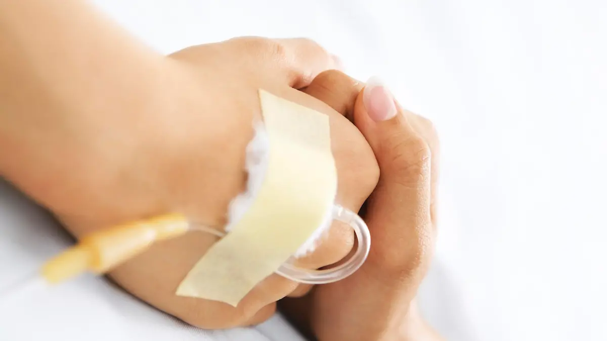 Hand holding together in hospital that injected in IV