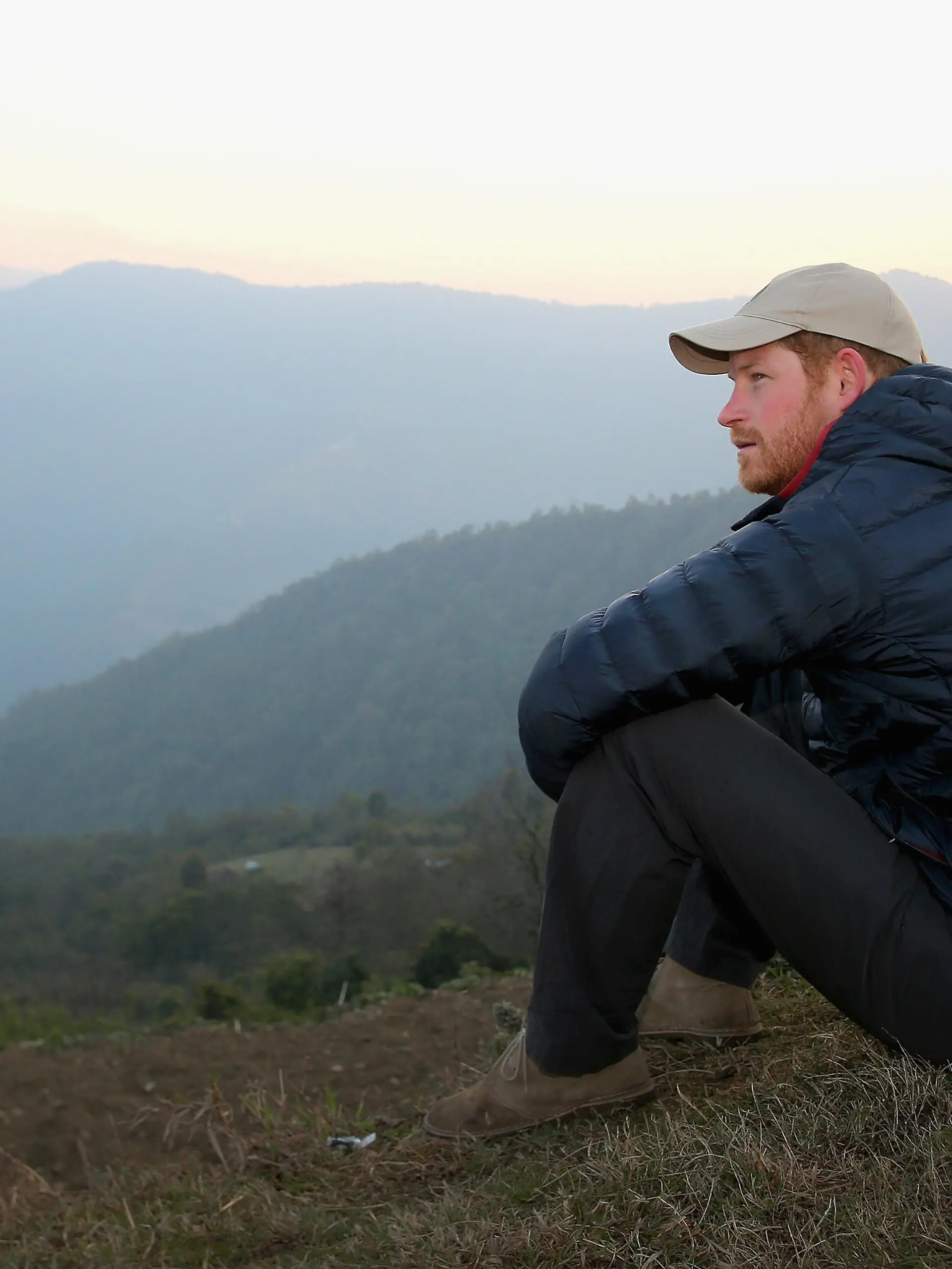 LEORANI, NEPAL - MARCH 22:  Prince Harry watches the sun rise after spending the night in the Himalayan  hilltop village of Leorani on day four of his visit to Nepal on March 22, 2016 in Leorani, Nepal. Prince Harry is on a five day visit to Nepal, his first official tour of the country.  (Photo by Chris Jackson - Pool/Getty Images)