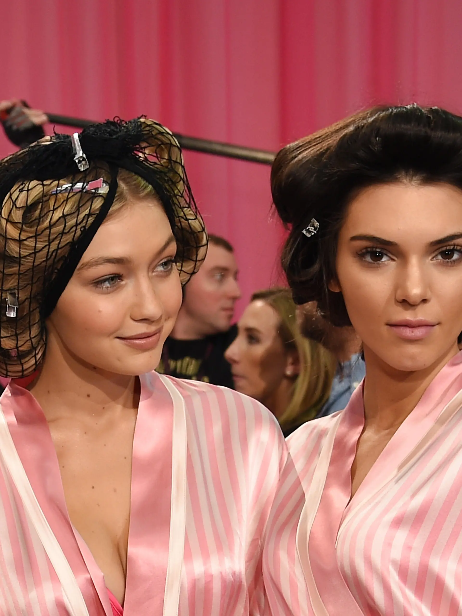 NEW YORK, NY - NOVEMBER 10:  Gigi Hadid (L) and Kendall Jenner are seen backstage before the 2015 Victoria's Secret Fashion Show at Lexington Avenue Armory on November 10, 2015 in New York City.  (Photo by Dimitrios Kambouris/Getty Images for Victoria's Secret)