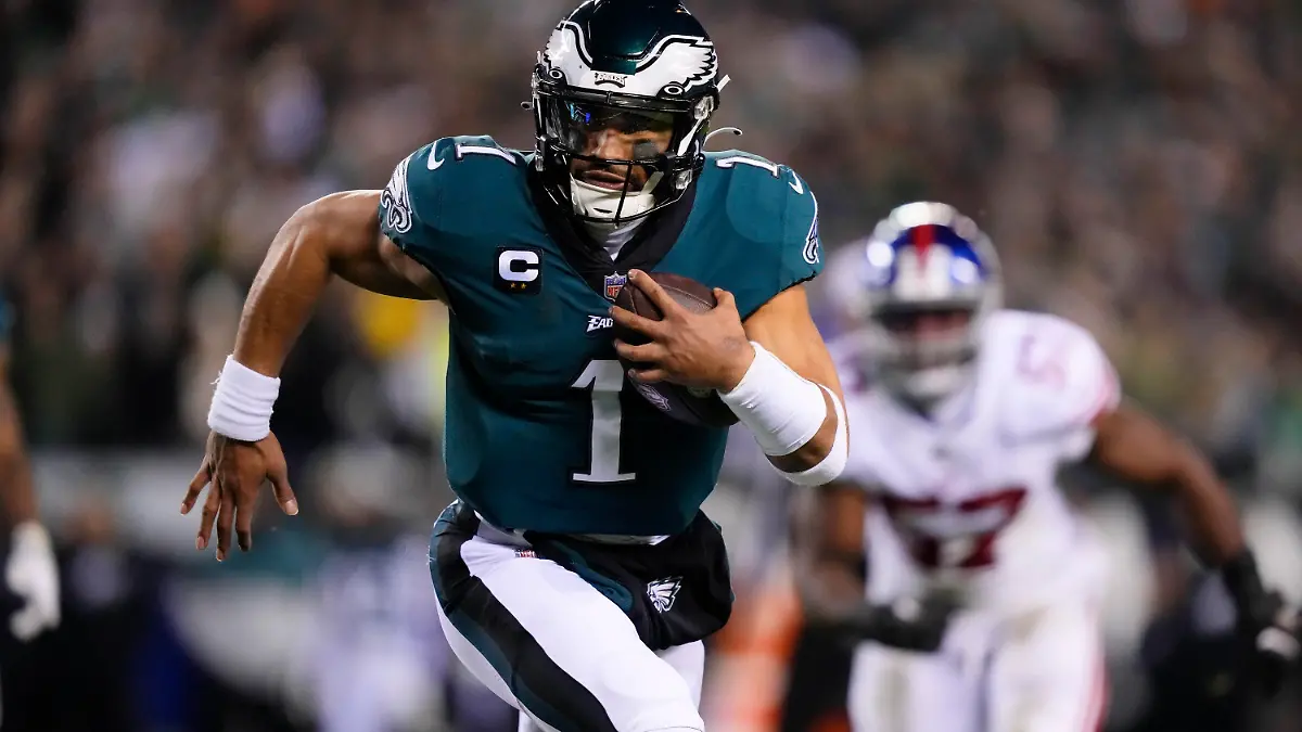 Philadelphia Eagles quarterback Jalen Hurts runs for a touchdown against the New York Giants during the first half of an NFL divisional round playoff football game, Saturday, Jan. 21, 2023, in Philadelphia. (AP Photo/Matt Rourke)