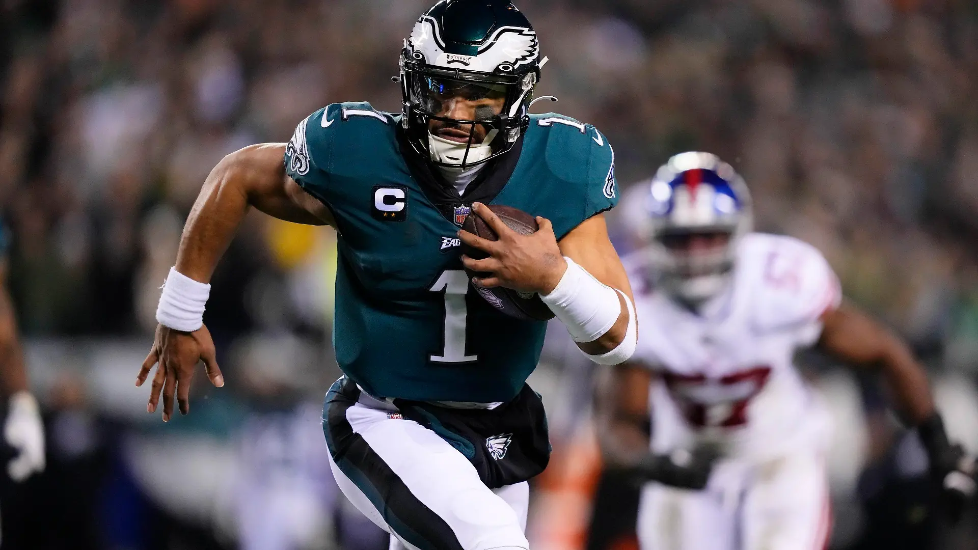 Philadelphia Eagles quarterback Jalen Hurts runs for a touchdown against the New York Giants during the first half of an NFL divisional round playoff football game, Saturday, Jan. 21, 2023, in Philadelphia. (AP Photo/Matt Rourke)