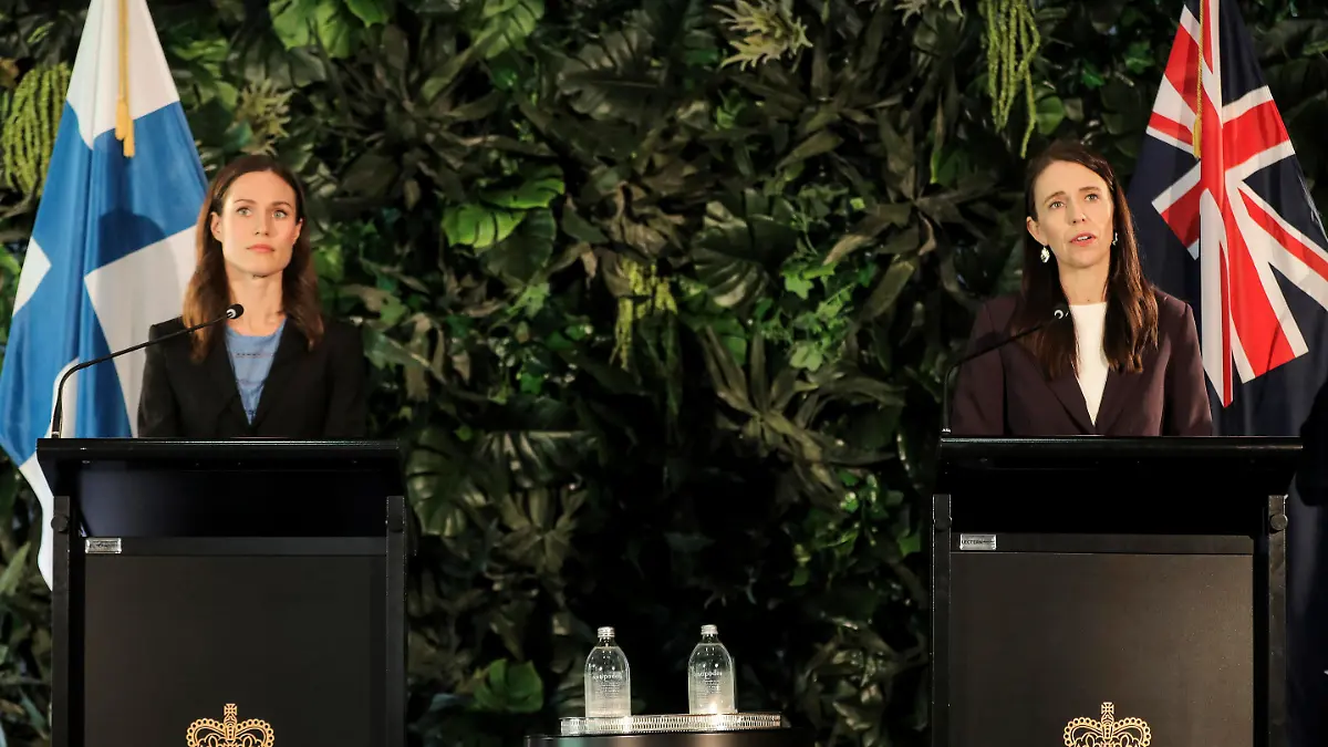 Finland's Prime Minister Sanna Marin, left, holds a joint press conference with New Zealand Prime Minister Jacinda Ardern at the Auckland Museum, in Auckland, New Zealand, Wednesday, Nov. 30, 2022. Marin says it must give more weapons and support to Ukraine to ensure it wins its war against Russia (Michael Craig/New Zealand Herald via AP)