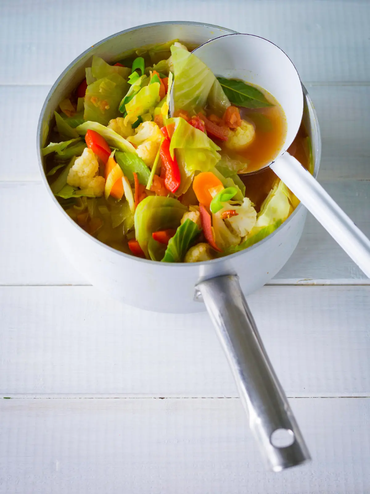 Cabbage soup in sauce pan
