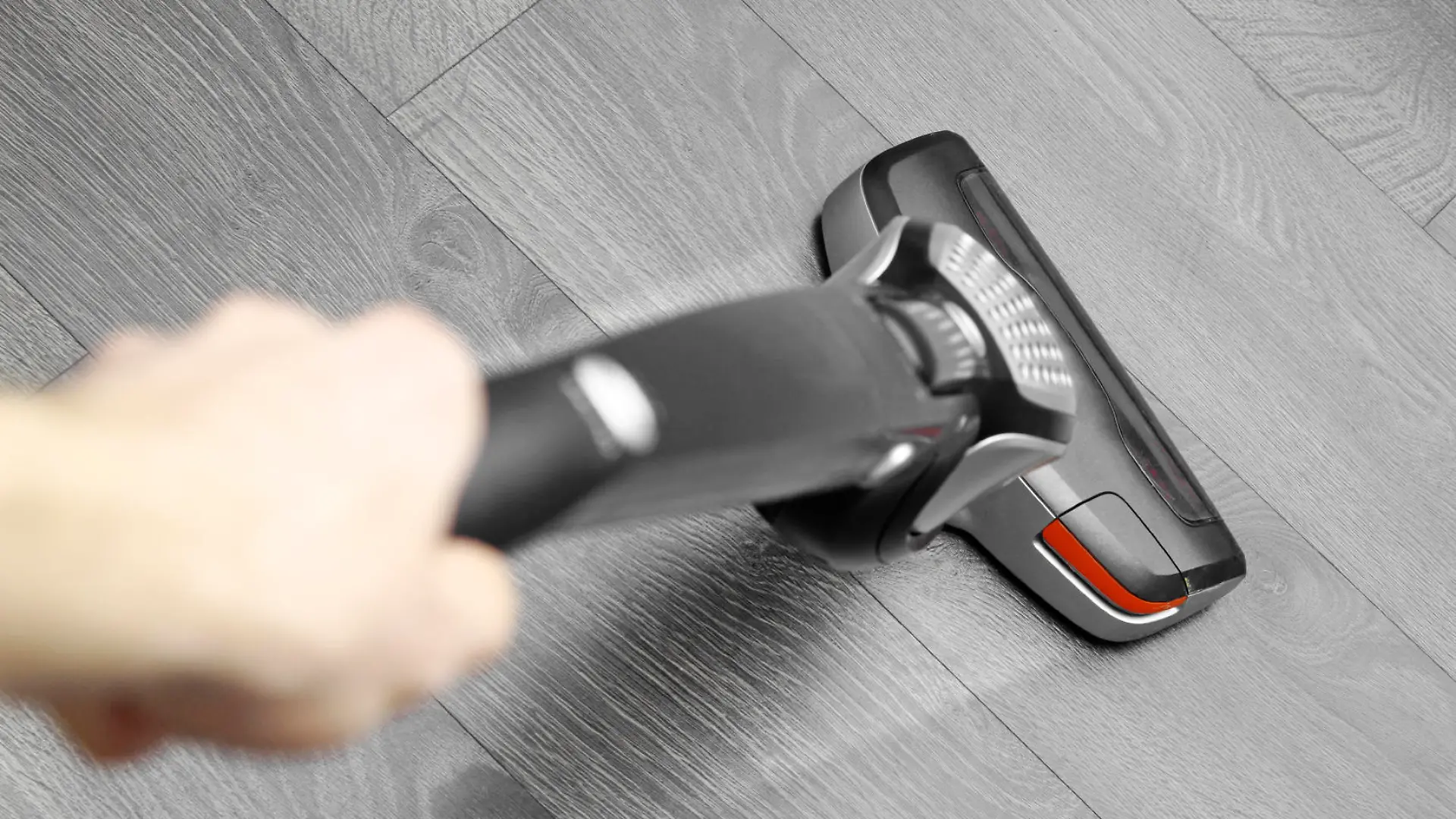 cleaning floor with cordless vacuum cleaner