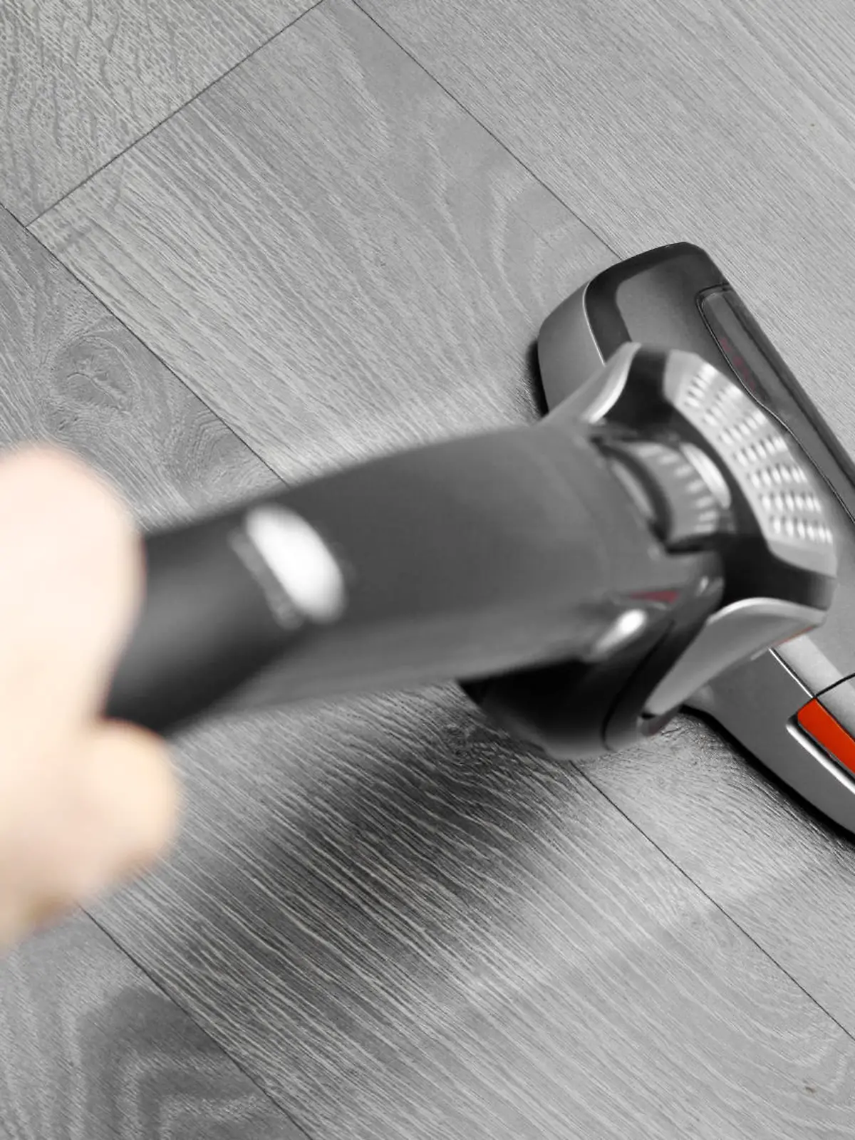 cleaning floor with cordless vacuum cleaner
