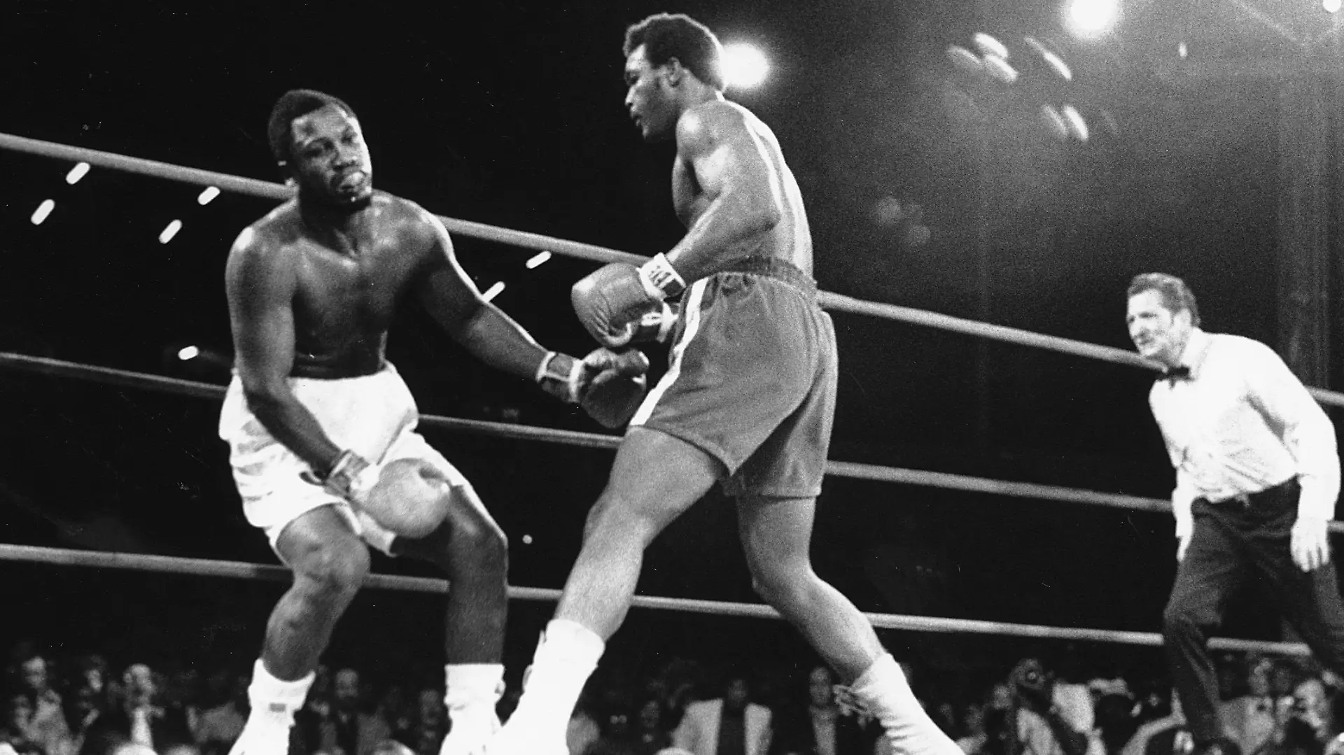 Heavyweight champion Joe Frazier, shown with blood coming from his mouth, starts falling after challenger George Foreman landed a hard right to the head in the second round of the fight in Kingston, Jamaica on Jan. 22, 1973. The World Heavyweight Championship title went to Foreman as the referee stopped the fight in the second round. (AP Photo)