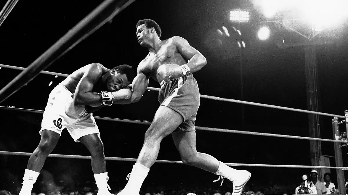 George Foreman slides a right past champion Joe Frazier's chin in the first round of the title fight in Kingston, Jamaica on Jan. 22, 1973. Foreman won the World Heavyweight Championship title bout in the second round after the referee stopped the fight. (AP Photo)