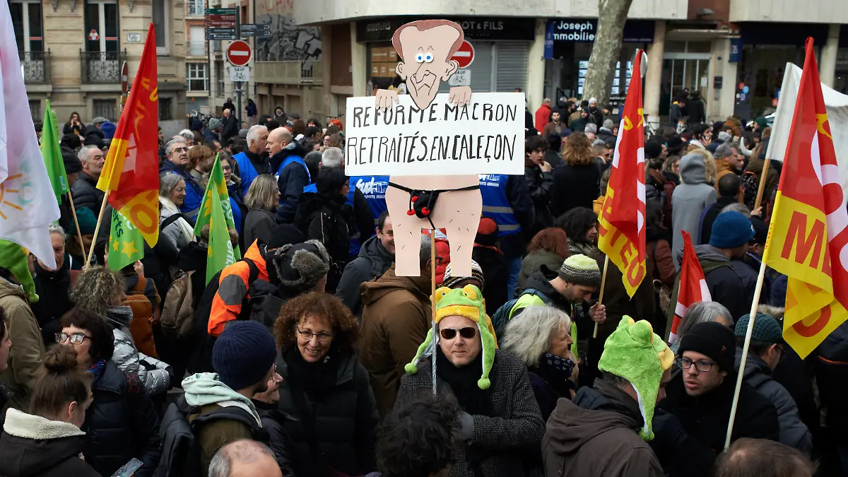 Toulouse: French Workers Strike Nationwide, Saying NO To Macron s Pension Reform A protester holds a puppet depicting Macron and reading Macron s reform, retired people in trunks . More than 50.000 people took to the streets in toulouse against the planned reform of pension and retirement age. France s labour unions have made a rare joint call for a day of major strike action and protests across France against plans by President Emmanuel Macron s government to reform the pension system and raise the retirement age to 64 from 62, a move opinion polls show is opposed by a vast majority 93% of workers already facing a cost-of-living crisis. Nearly all sectors unions called for this strike and protest : mining and energy, health, schooling PUBLICATIONxNOTxINxFRA Copyright: xAlainxPittonx originalFilename: pitton-notitle230119_npTtq.jpg