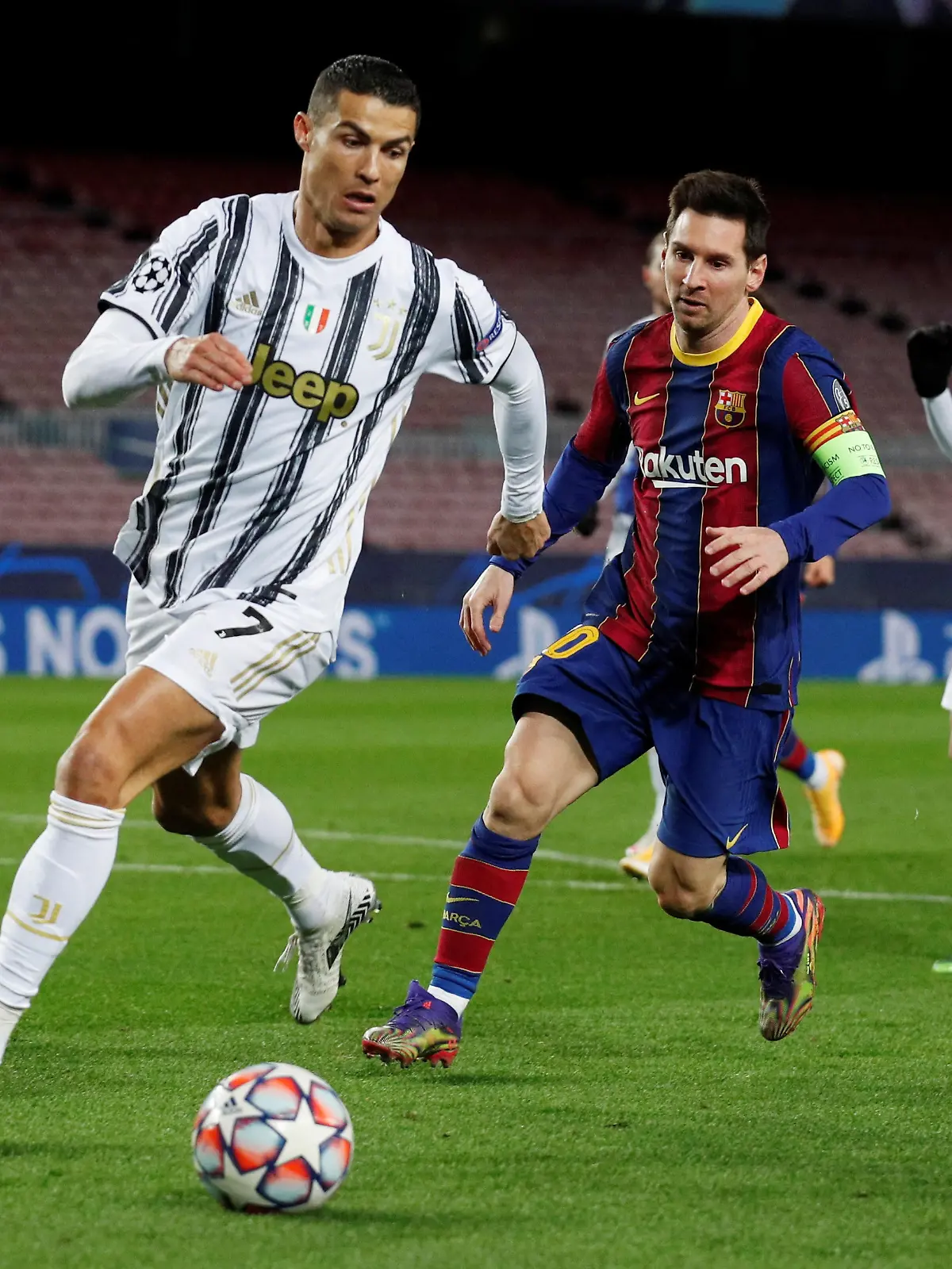 FILE PHOTO: Soccer Football - Champions League - Group G - FC Barcelona v Juventus - Camp Nou, Barcelona, Spain - December 8, 2020 FC Barcelona's Lionel Messi in action with Juventus' Cristiano Ronaldo REUTERS/Albert Gea/File Photo