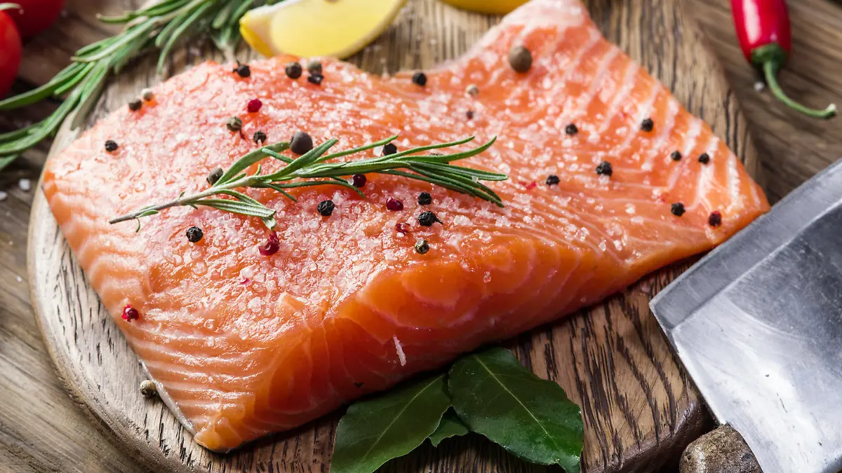 Fresh salmon on the cutting board. Cooking process.