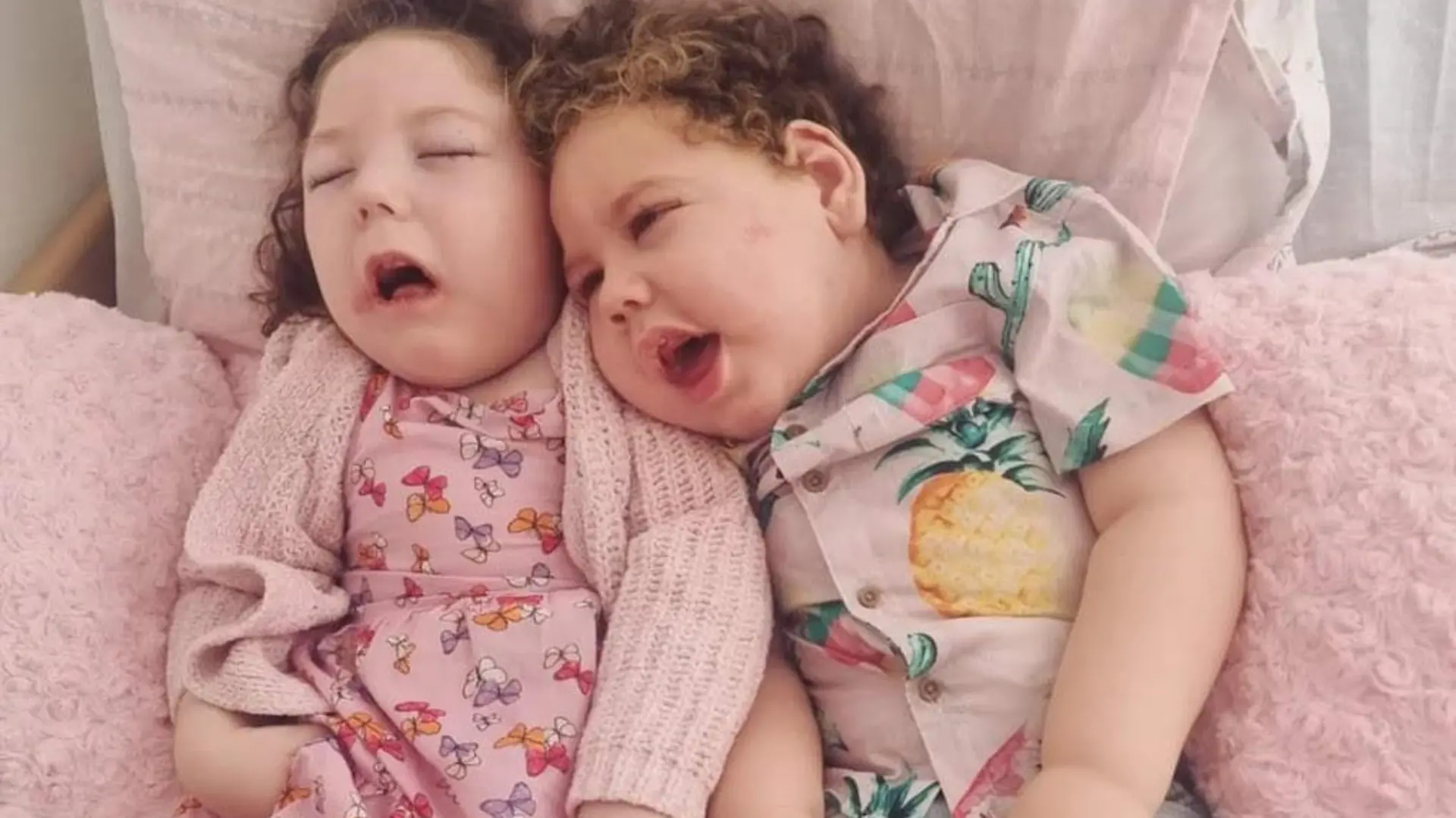 Story from Jam Press (Disabled Children Trolled)
Pictured: Ava-Grace and Henry.
'Cruel trolls say our disabled children should be 'put down' because they will die young – but we're focusing on celebrating the time we have left'
A young couple have revealed the "devastating" toll a rare condition is having on their tots – but hope to educate online trolls about their battle.
Charlotte Smith, 29, and her partner, Tom Harding, 26, from Bridlington, Yorkshire, have shared their heartbreak after discovering both of their children, Ava-Grace, four and Henry, two, are living on borrowed time.
Upon realising their tots weren't reaching certain milestones as expected, they sought out medical advice and the children were diagnosed with both lissencephaly and microcephaly.
Heartbreakingly, the health problems associated with the conditions often makes lifespan shorter – with the tots given an average predicted lifespan of just 10 years old.
But instead of grieving the limited time they have left, Charlotte and Tom have decided to celebrate their little ones' lives and make each day full of adventure.
However, the family-of-four have been "targeted" online with cruel comments from trolls, but in a bid to challenge the negativity, they hope to educate others on the condition with their 55,000 followers on TikTok.
"We've had people leave harsh comments such as: 'Can't wait to pay for these vegetables for the rest of my life' because we're on disability allowance," Charlotte told NeedToKnow.Online.
"Others have said: 'They need putting down, no quality of life' and it's hurtful, but we try not to listen to them.
"Instead, a lot of the toxic comments are deleted, but we still don't understand why people feel the need to do this.
"Charlotte likes to put out content on an average day in our lives and things about the kids, that's the most important thing to us.
"The conditions have stopped all milestones and they can't develop past the state of three months