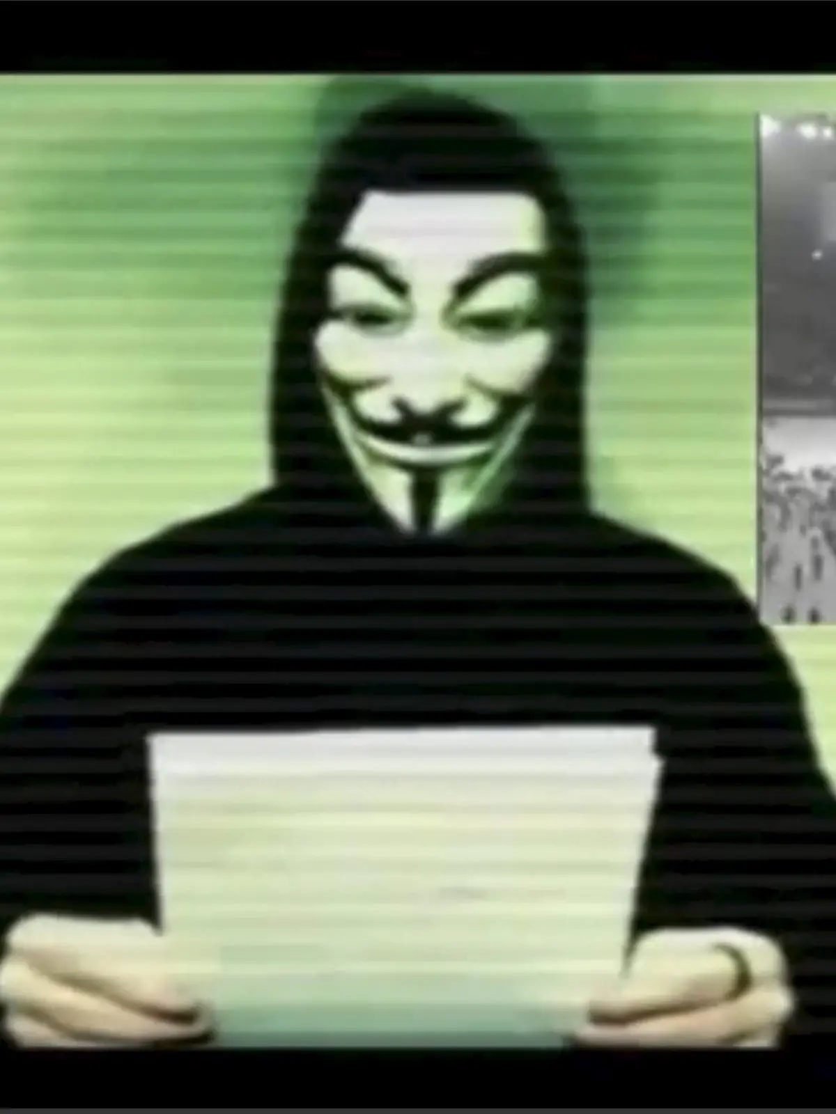 A man wearing a mask associated with Anonymous makes a statement in this still image from a video released on November 16, 2015. The Anonymous hackers collective is preparing to unleash waves of cyberattacks on Islamic State following the attacks in Paris last week that killed 129 people, it declared in the video posted online. REUTERS/Social Media Website via Reuters TV ATTENTION EDITORS - THIS PICTURE WAS PROVIDED BY A THIRD PARTY. REUTERS IS UNABLE TO INDEPENDENTLY VERIFY THE AUTHENTICITY, CONTENT, LOCATION OR DATE OF THIS IMAGE. FOR EDITORIAL USE ONLY. NOT FOR SALE FOR MARKETING OR ADVERTISING CAMPAIGNS. NO RESALES. NO ARCHIVE. THIS PICTURE IS DISTRIBUTED EXACTLY AS RECEIVED BY REUTERS, AS A SERVICE TO CLIENTS.      TPX IMAGES OF THE DAY