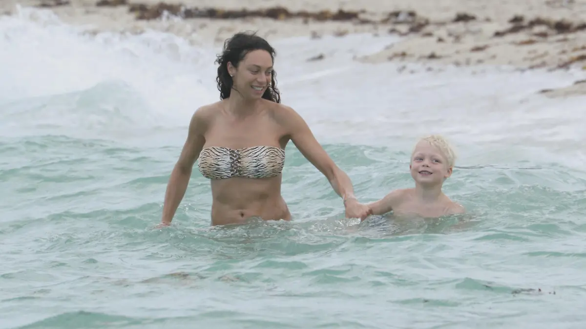Model, Lilly Becker, and son, Amadeus, take a swim in the ocean in Miami Beach, FL. Lilly and Amadeus fought the waves while cooling off on a beach day. Amadeus wore colourful Vilebrequin swim trunks while his mother wore an animal print bandeau bikini.<P>Pictured: Lilly Becker and Amadeus Becker<B>Ref: SPL997536 120415 </B><BR/>Picture by: Pichichi/Splash News<BR/></P><P><B>Splash News and Pictures</B><BR/>Los Angeles: 310-821-2666<BR/>New York: 212-619-2666<BR/>London: 870-934-2666<BR/>photodesk@splashnews.com<BR/></P>