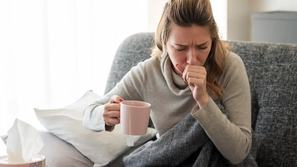 Sick woman with flu at home.