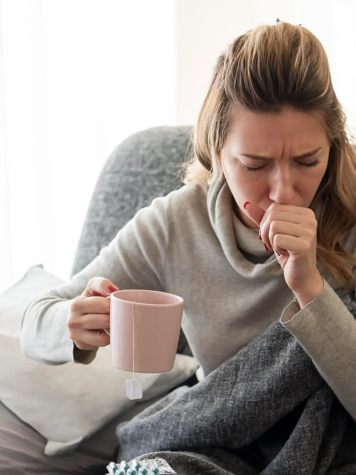 Sick woman with flu at home.
