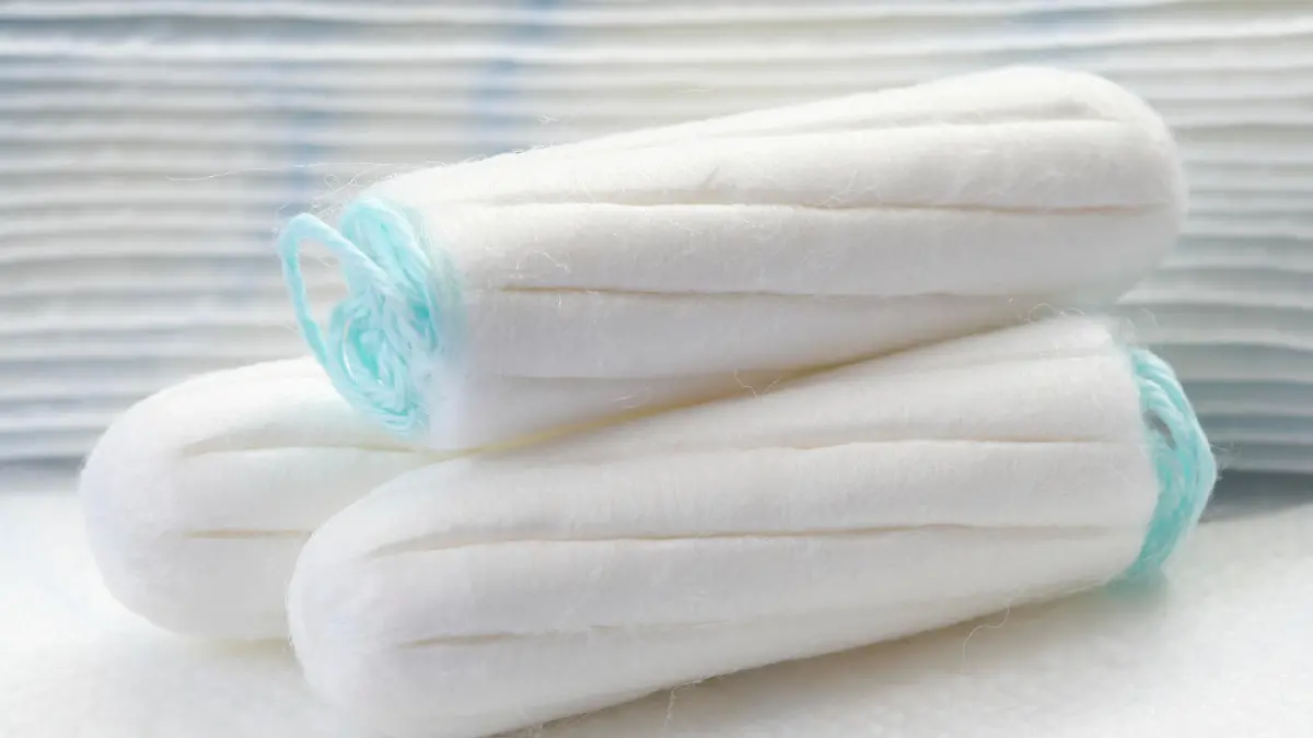 health care and medicine - white tampons on blue background