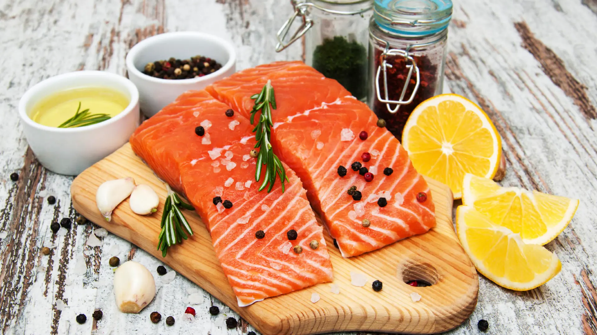portions of fresh salmon fillet with aromatic herbs, spices and vegetables