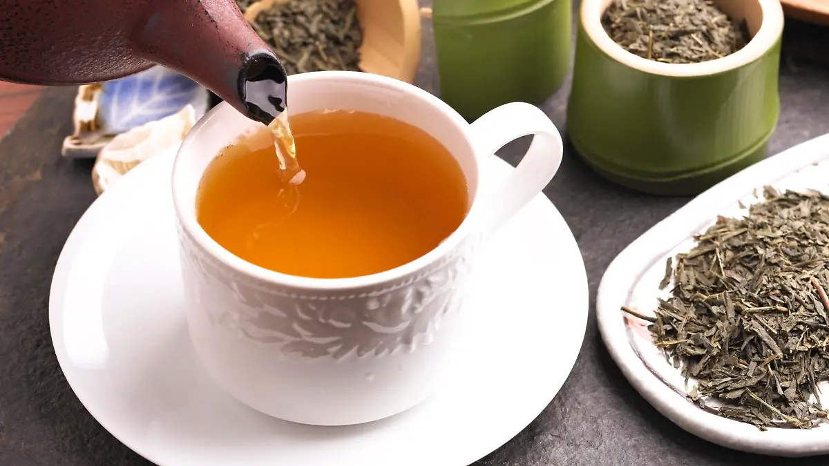 Green Tea Pouring into a Cup