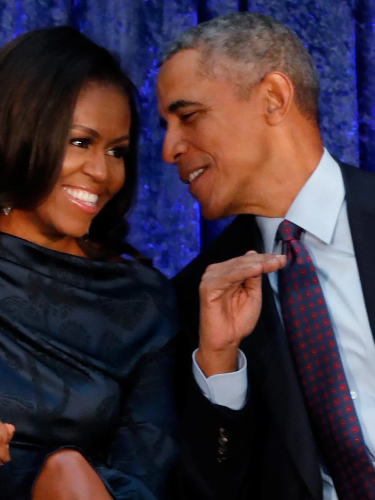 FILE PHOTO: Former U.S. President Barack Obama sits with former first lady Michelle Obama prior to the the unveiling of their portraits at the Smithsonian’s National Portrait Gallery in Washington, DC, U.S., February 12, 2018.  REUTERS/Jim Bourg/File Photo
