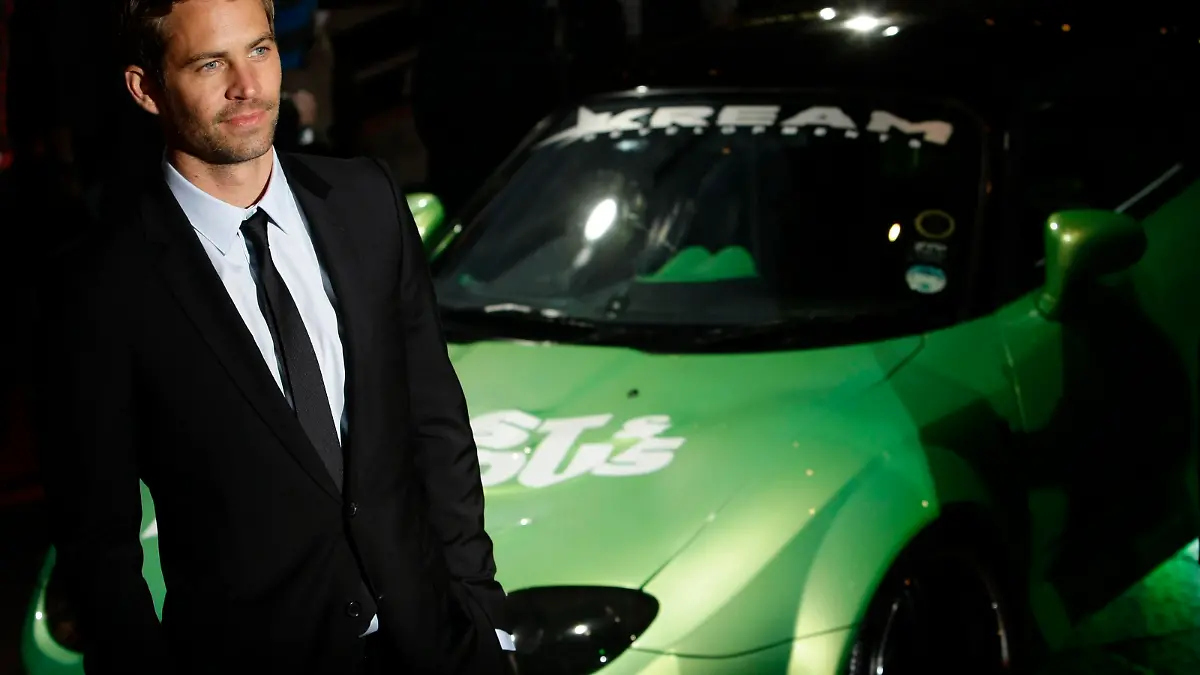 Actor Paul Walker arrives for the British premiere of "Fast & Furious" in Leicester Square in London, in this file photo taken March 19, 2009.   The daughter of late actor Walker, filed a wrongful death lawsuit against automaker, Porsche, claiming in the complaint that the company skimped on safety features for the vehicle, which could have either prevented the crash entirely or at least kept Walker alive.  REUTERS/Stefan Wermuth/Files