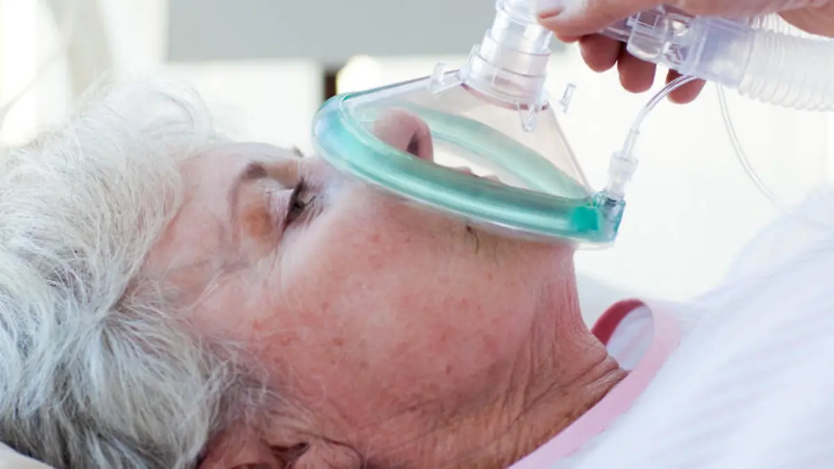 Close-up of a female patient receiving oxygen mask in an emergency unit
