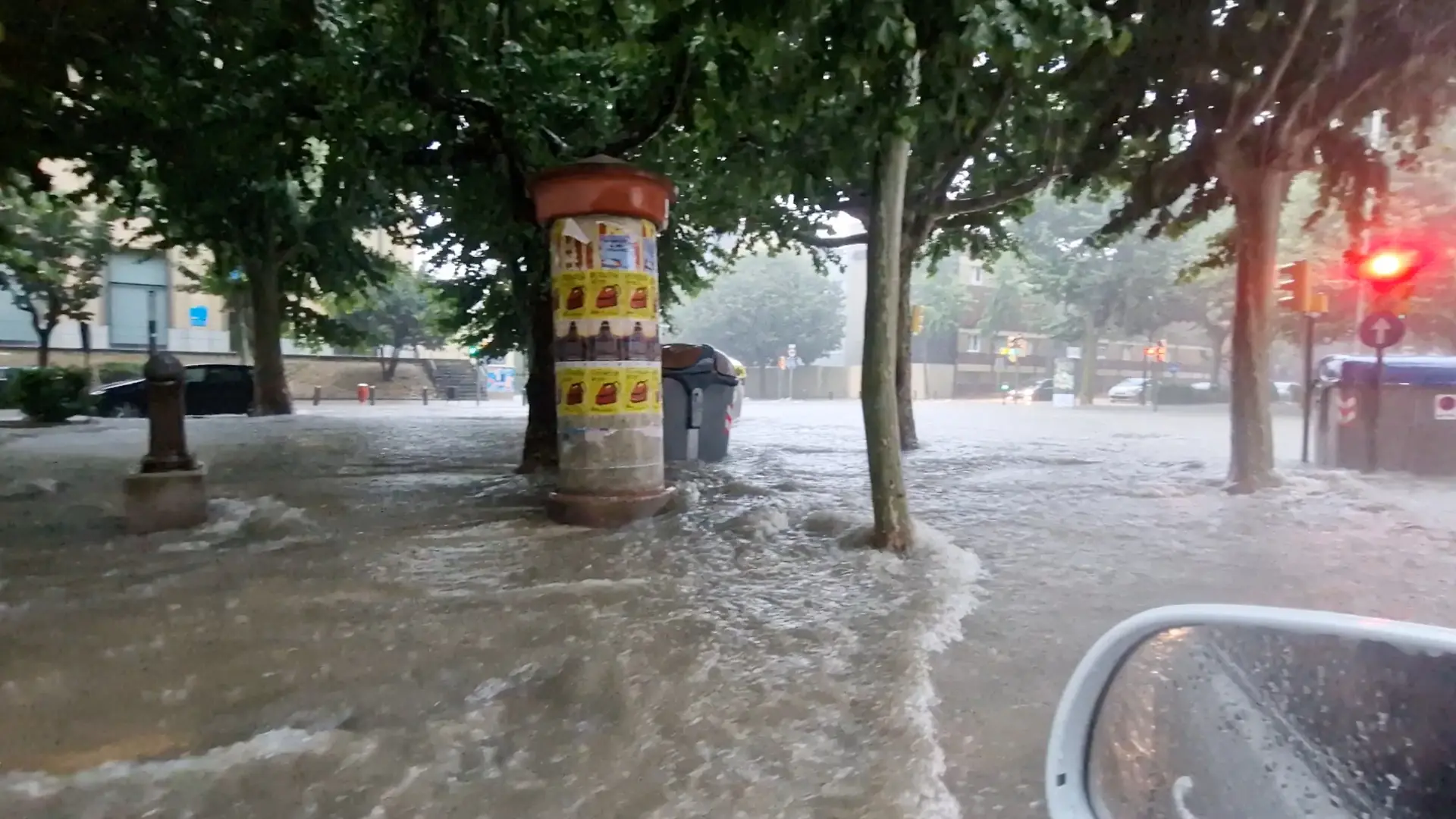 Flood water flows as it rains in Igualada, Spain July 12, 2025 in this screengrab obtained from a social media video. Jordi Miserachs/via REUTERS THIS IMAGE HAS BEEN SUPPLIED BY A THIRD PARTY. MANDATORY CREDIT. NO RESALES. NO ARCHIVES. VERIFICATION - Road layout, trees, buildings’ facades, street lights and businesses logos that match file and satellite imagery - Coordinates included in original file metadata - Date was verified by original file metadata