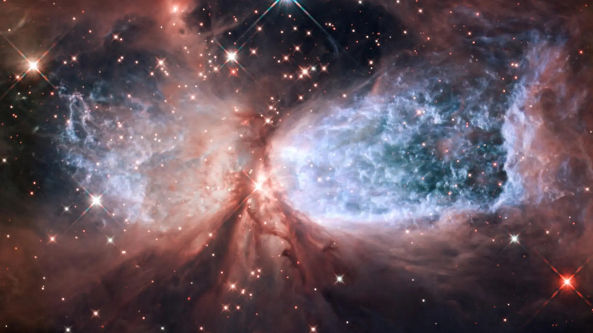 Image #: 16674145 Hubble Serves Up a Holiday Snow Angel The bipolar star-forming region, called Sharpless 2-106, looks like a soaring, celestial snow angel. The outstretched "wings" of the nebula record the contrasting imprint of heat and motion against the backdrop of a colder medium. Twin lobes of super-hot gas, glowing blue in this image, stretch outward from the central star. This hot gas creates the "wings" of our angel. A ring of dust and gas orbiting the star acts like a belt, cinching the expanding nebula into an "hourglass" shape. MAI/NASA /Landov Keine Weitergabe an Drittverwerter.