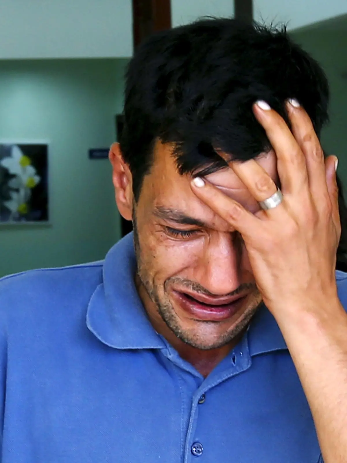Abdullah Kurdi, father of three-year old Aylan Kurdi, cries as he leaves a morgue in Mugla, Turkey, September 3, 2015. The family of Aylan, a Syrian toddler whose body washed up on a Turkish beach, had been trying to emigrate to Canada after fleeing the war-torn town of Kobani, one of their relatives told a Canadian newspaper on Thursday. A photograph of the tiny body of three-year old Aylan Kurdi washed up in the Aegean resort of Bodrum swept social media on Wednesday, spawning sympathy and outrage at the perceived inaction of developed nations in helping refugees. His 5-year-old brother Galip and mother Rehan, 35, also died after their boat capsized while trying to reach the Greek island of Kos. His father, Abdullah, was found semi-conscious and taken to hospital near Bodrum, according to Turkey's Sabah newspaper.  REUTERS/Murad Sezer      TPX IMAGES OF THE DAY     