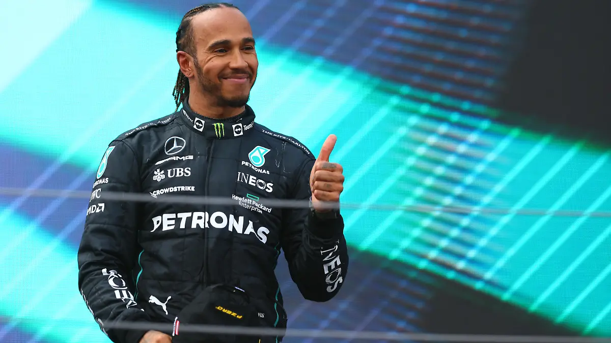 SPIELBERG, AUSTRIA - JULY 10: Third placed Lewis Hamilton of Great Britain and Mercedes celebrates on the podium during the F1 Grand Prix of Austria at Red Bull Ring on July 10, 2022 in Spielberg, Austria. (Photo by Clive Rose/Getty Images)