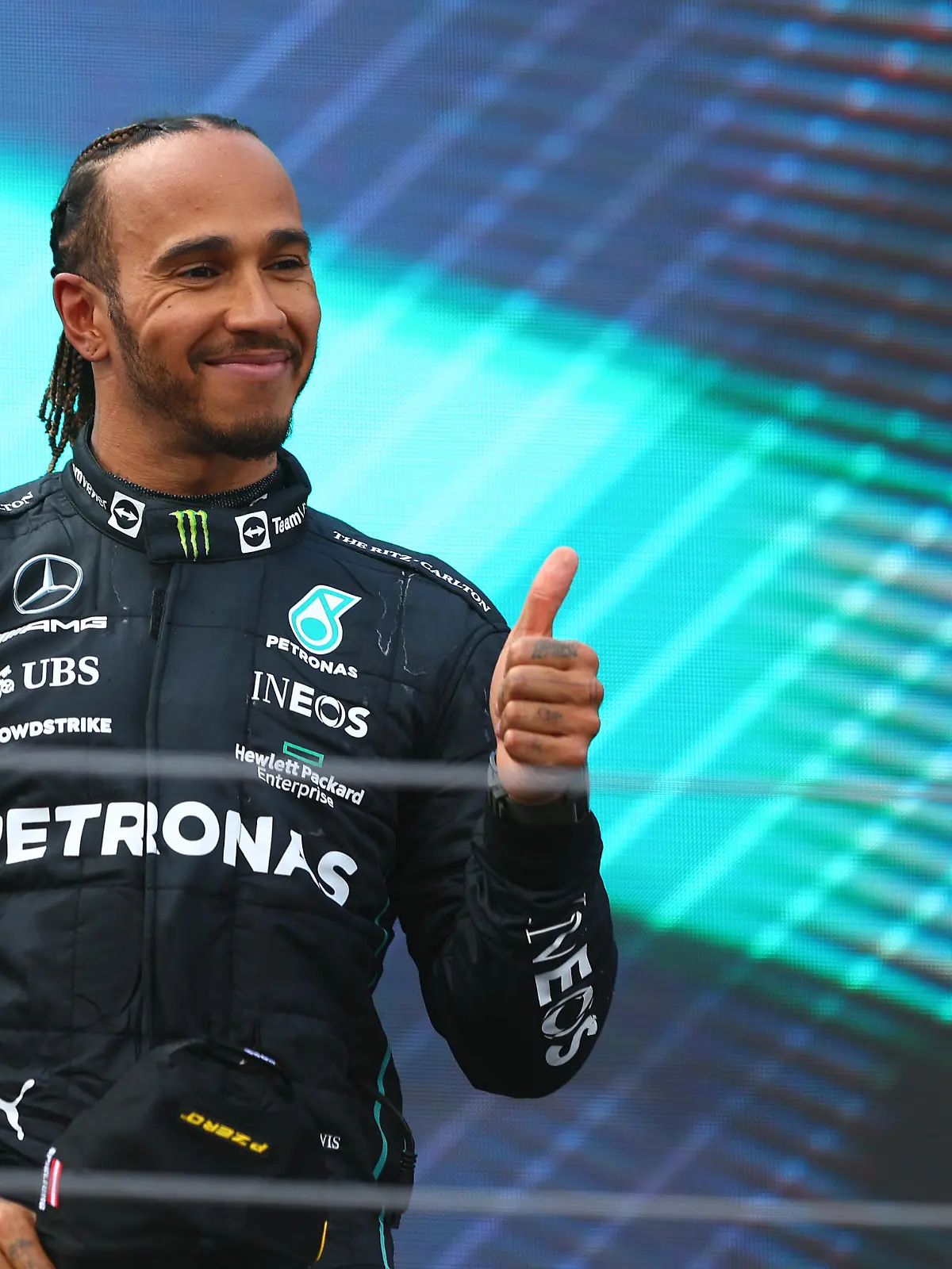 SPIELBERG, AUSTRIA - JULY 10: Third placed Lewis Hamilton of Great Britain and Mercedes celebrates on the podium during the F1 Grand Prix of Austria at Red Bull Ring on July 10, 2022 in Spielberg, Austria. (Photo by Clive Rose/Getty Images)