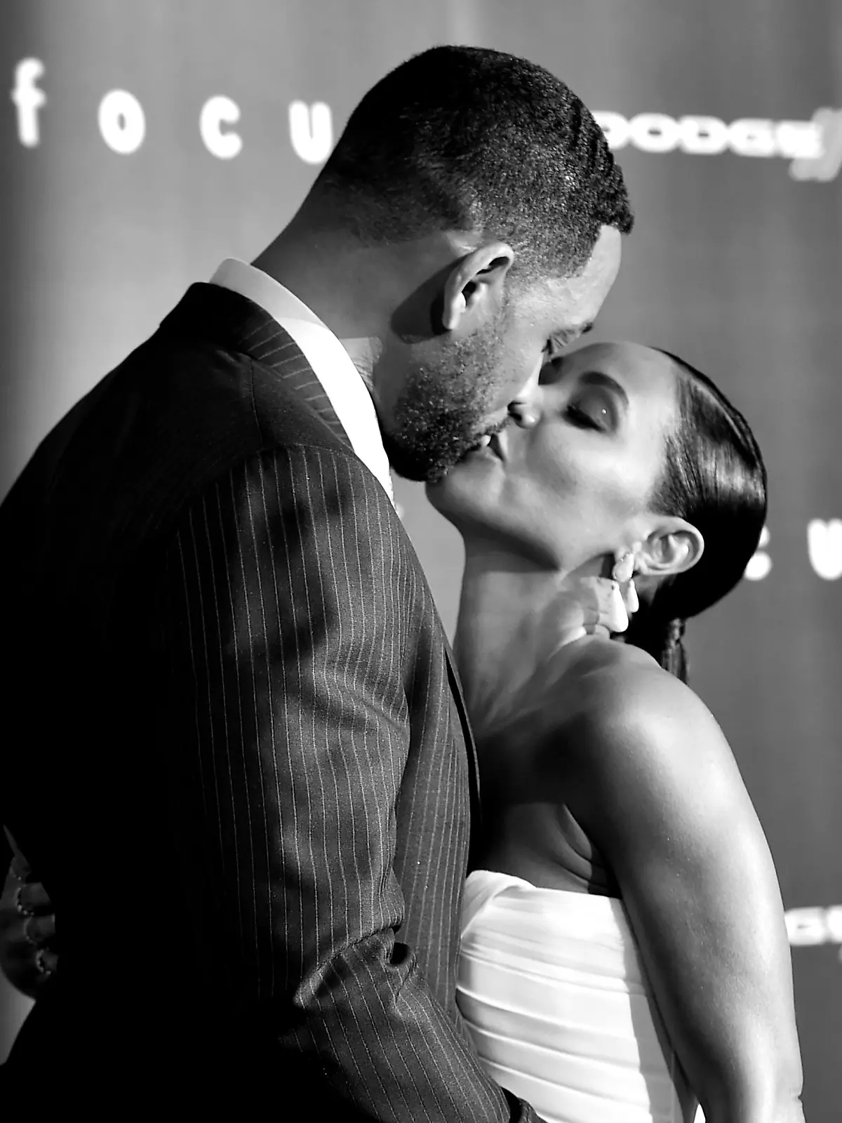 LOS ANGELES, CA - FEBRUARY 24:  (EDITORS NOTE: Image was converted to black and white.) Actors Will Smith (L) and Jada Pinkett Smith arrive at the premiere of Warner Bros. Pictures' 'Focus' at the Chinese Theatre on February 24, 2015 in Los Angeles, California.  (Photo by Kevin Winter/Getty Images)