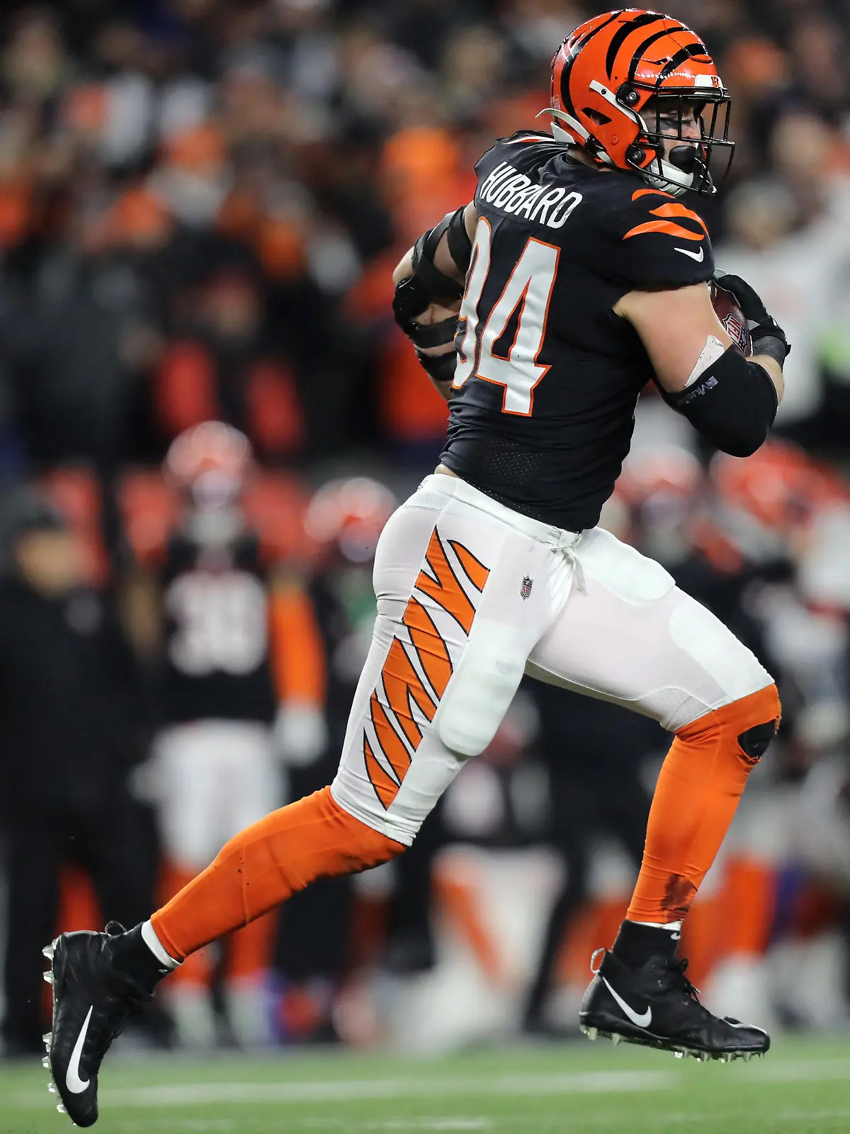 Jan 15, 2023; Cincinnati, Ohio, USA; Cincinnati Bengals defensive end Sam Hubbard (94) runs with the ball for a touchdown after a fumble recovery during the second half in a wild card game against the Baltimore Ravens at Paycor Stadium. Mandatory Credit: Katie Stratman-USA TODAY Sports