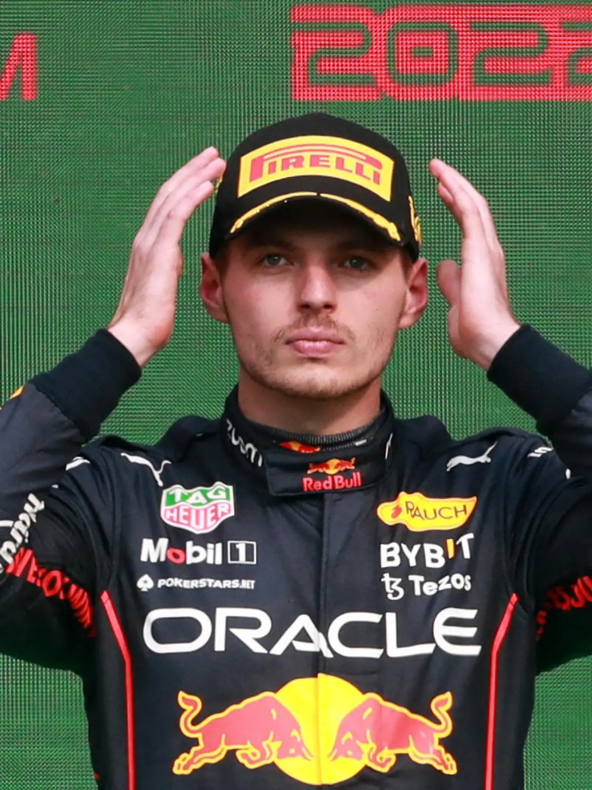 Formula One F1 - Mexico City Grand Prix - Autodromo Hermanos Rodriguez, Mexico City, Mexico - October 30, 2022 Red Bull's Max Verstappen celebrates on the podium after winning the race and setting a new F1 record of 14 grand prix wins in a season REUTERS/Henry Romero